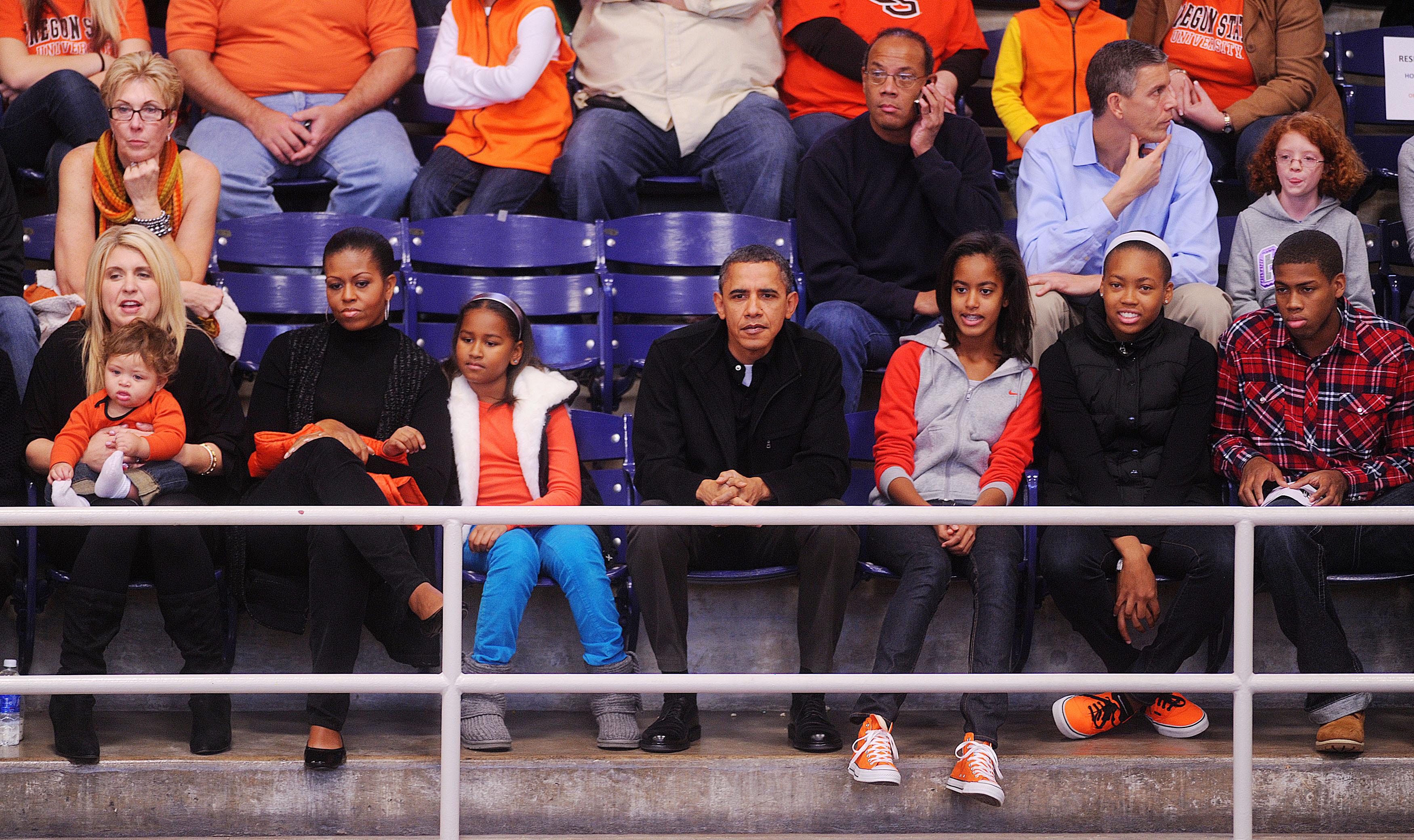 WASHINGTON - NOVEMBER 27: (AFP OUT) U.S. President Barack Obama with his wife First Lady Michelle Obama and daughters Malia and Sasha watches a college basketball game at Howard University November 27, 2010 in Washington, DC. President Barack Obama atte