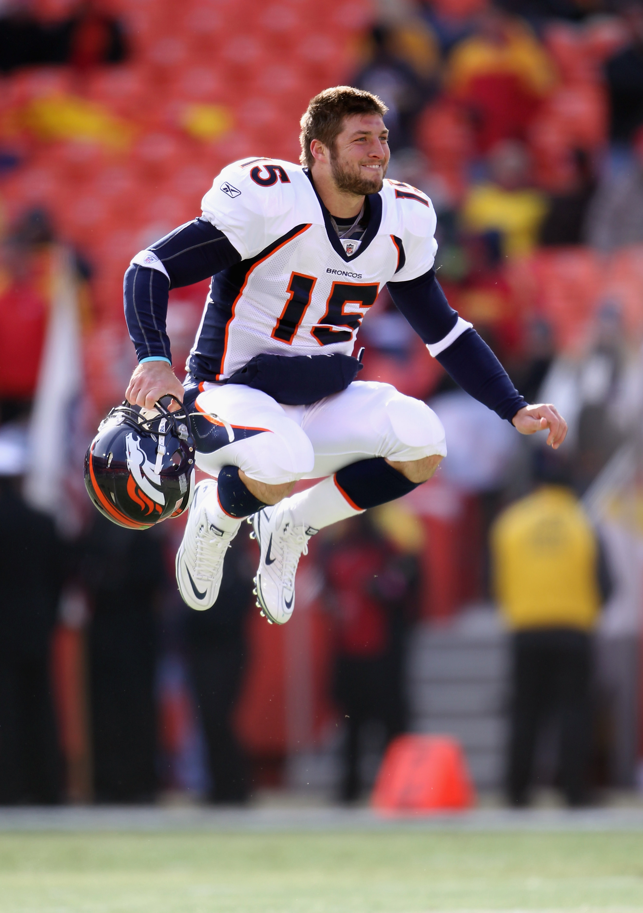 KANSAS CITY, MO - DECEMBER 05:  Quarterback Tim Tebow #15 of the Denver Broncos stretches during warm-ups prior to the start of the game against the Kansas City Chiefs on December 5, 2010 at Arrowhead Stadium in Kansas City, Missouri.  (Photo by Jamie Squ