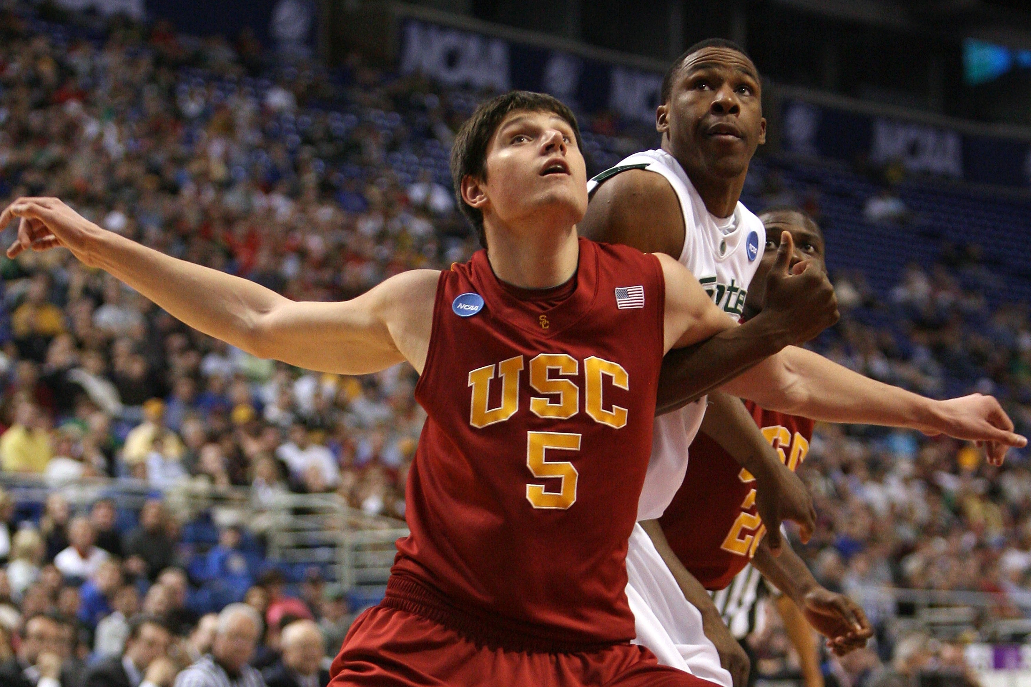 MINNEAPOLIS - MARCH 22: Nikola Vucevic #5 of the USC Trojans fights for position under the basket against Delvon Roe #10 of the Michigan State Spartans during the second round of the NCAA Division I Men's Basketball Tournament at the Hubert H. Humphrey M