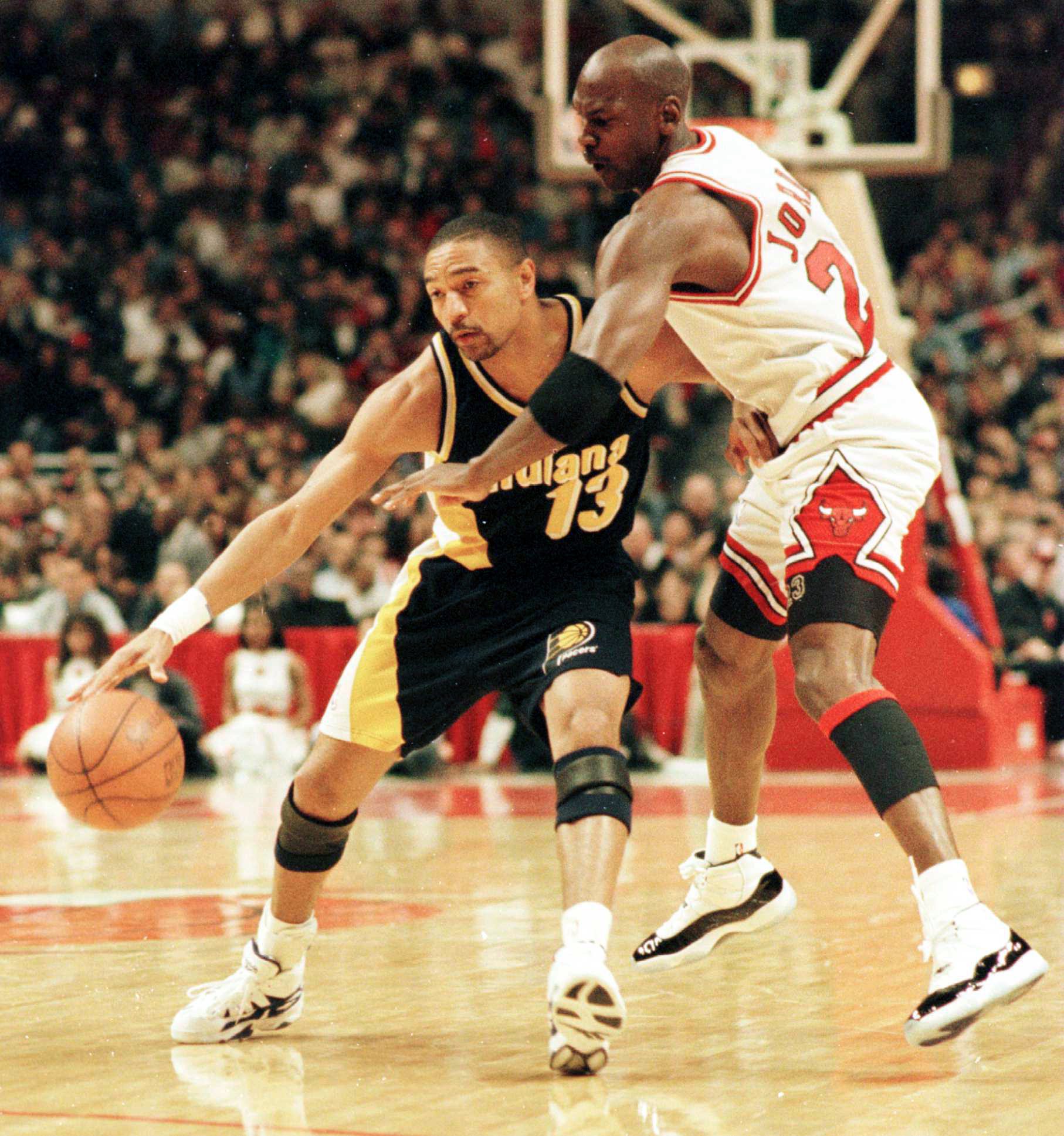 20 Apr 1996:  Point guard Mark Jackson of the Indiana Pacers fends off the defensive pressure applied by guard Michael Jordan of the Chicago bulls during the first quarter of the Bulls game against the Pacers at the United Center in Chicago, Illinois. Man