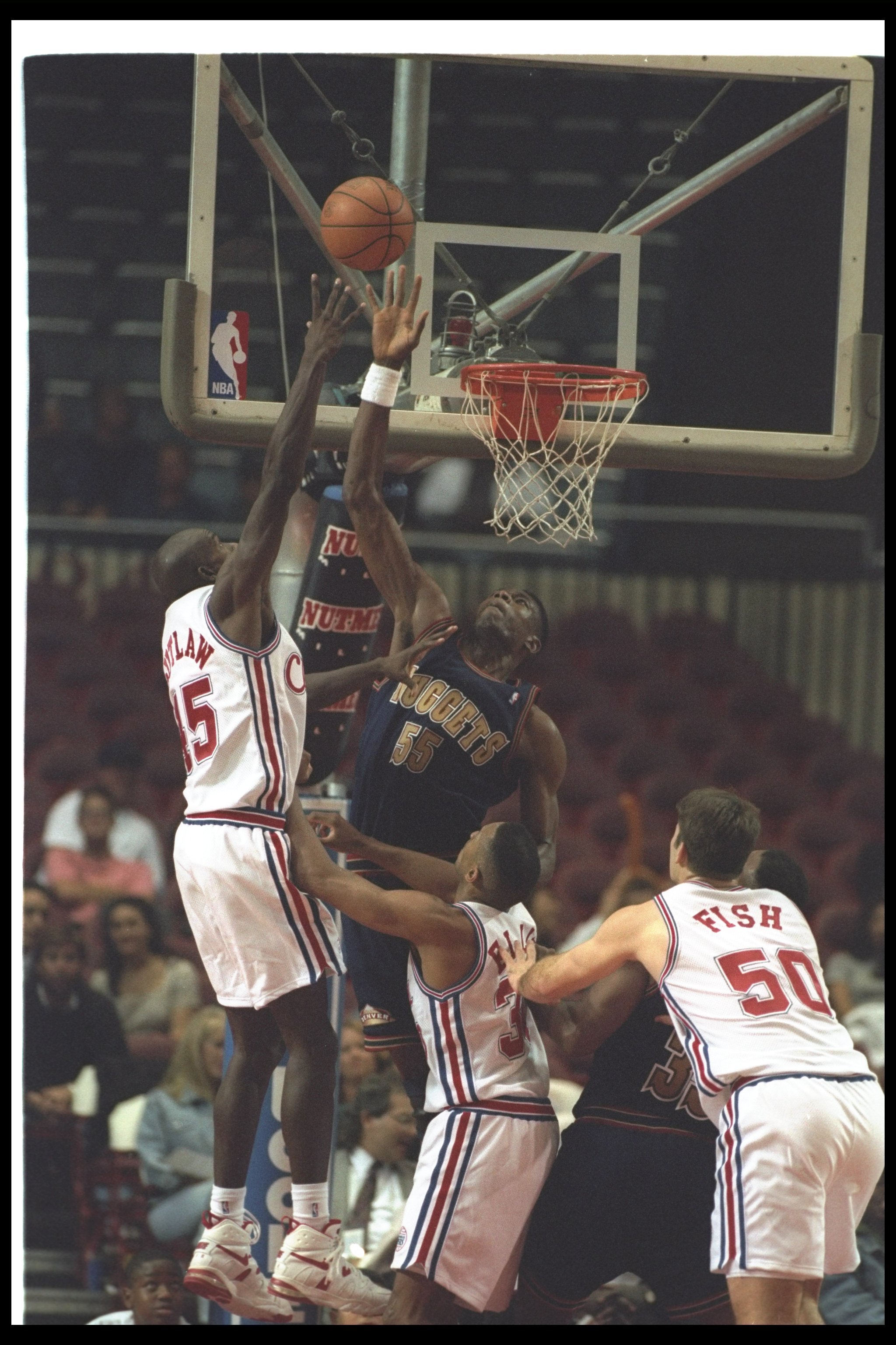 19 Oct 1994: Center Dikembe Mutombo of the Denver Nuggets goes up for the ball during a pre-season game against the Los Angeles Clippers at the Sports Arena in Los Angeles, California. The Nuggets won the game, 96-90.