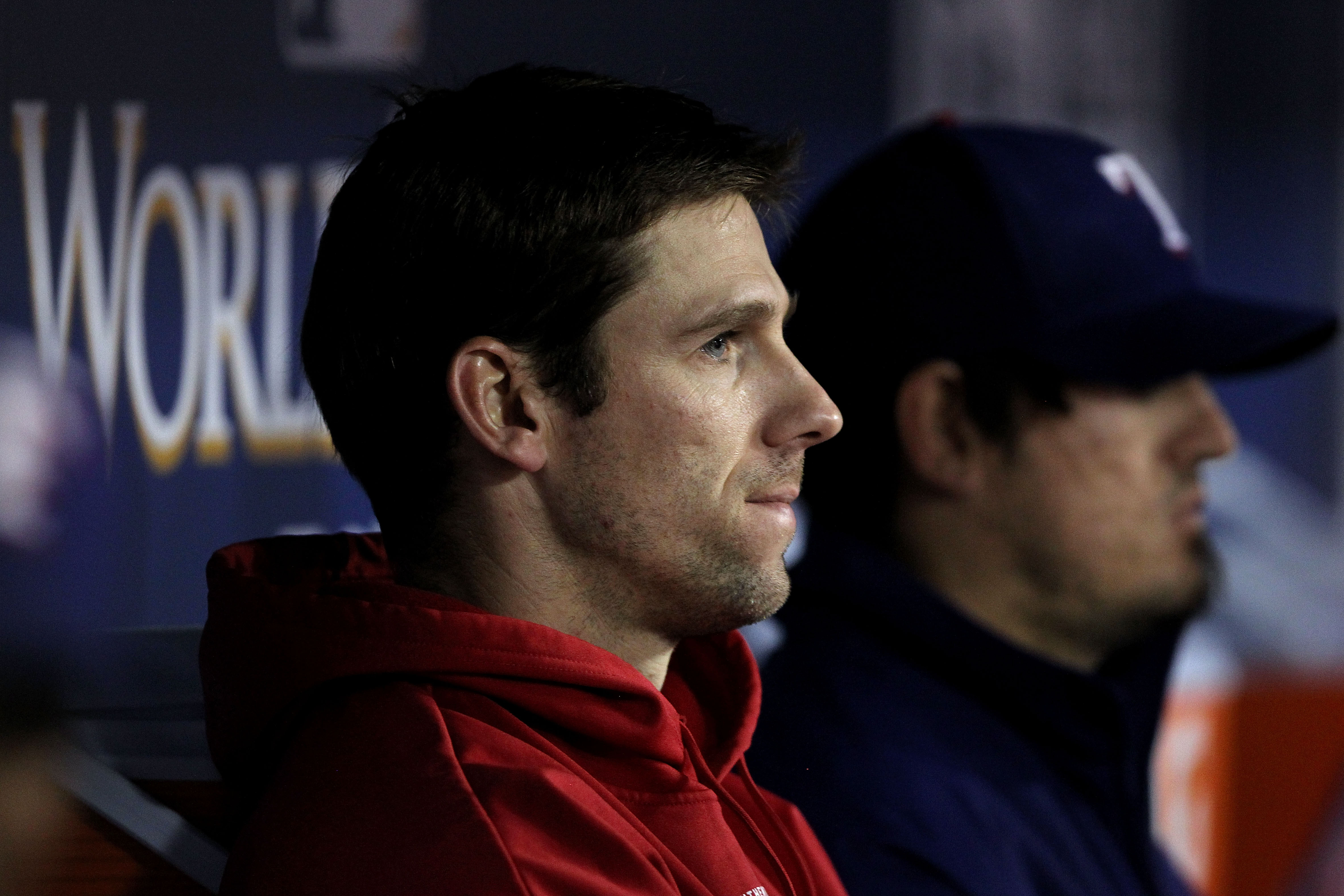 ARLINGTON, TX - NOVEMBER 01:  Losing pitcher Cliff Lee #33 of the Texas Rangers looks on from the dugout against the San Francisco Giants in Game Five of the 2010 MLB World Series at Rangers Ballpark in Arlington on November 1, 2010 in Arlington, Texas.