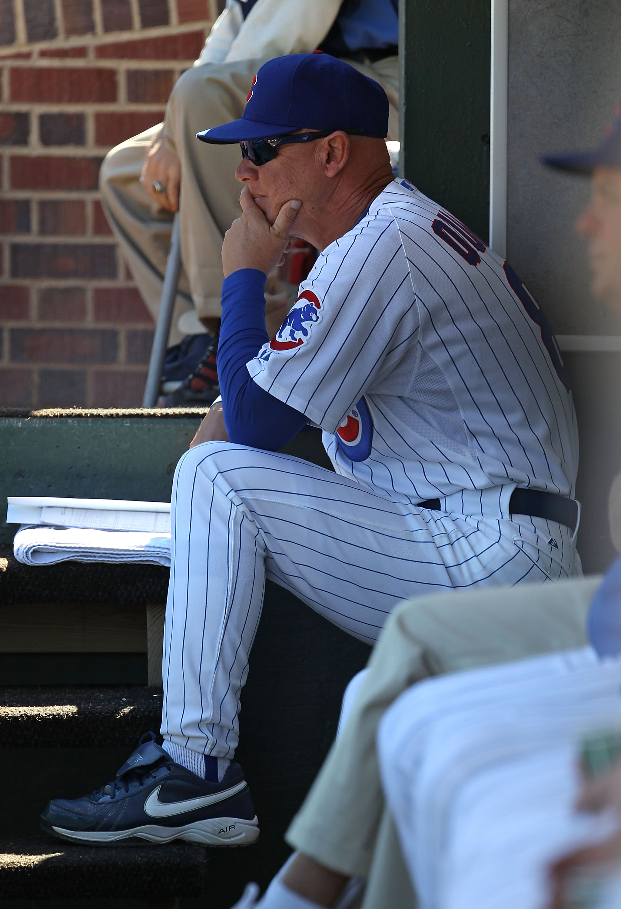 CHICAGO - SEPTEMBER 24: Interim manager Mike Quade #8 of the Chicago Cubs watches as his team takes on the St. Louis Cardinals at Wrigley Field on September 24, 2010 in Chicago, Illinois. The CArdinals defeated the Cubs 7-1. (Photo by Jonathan Daniel/Gett