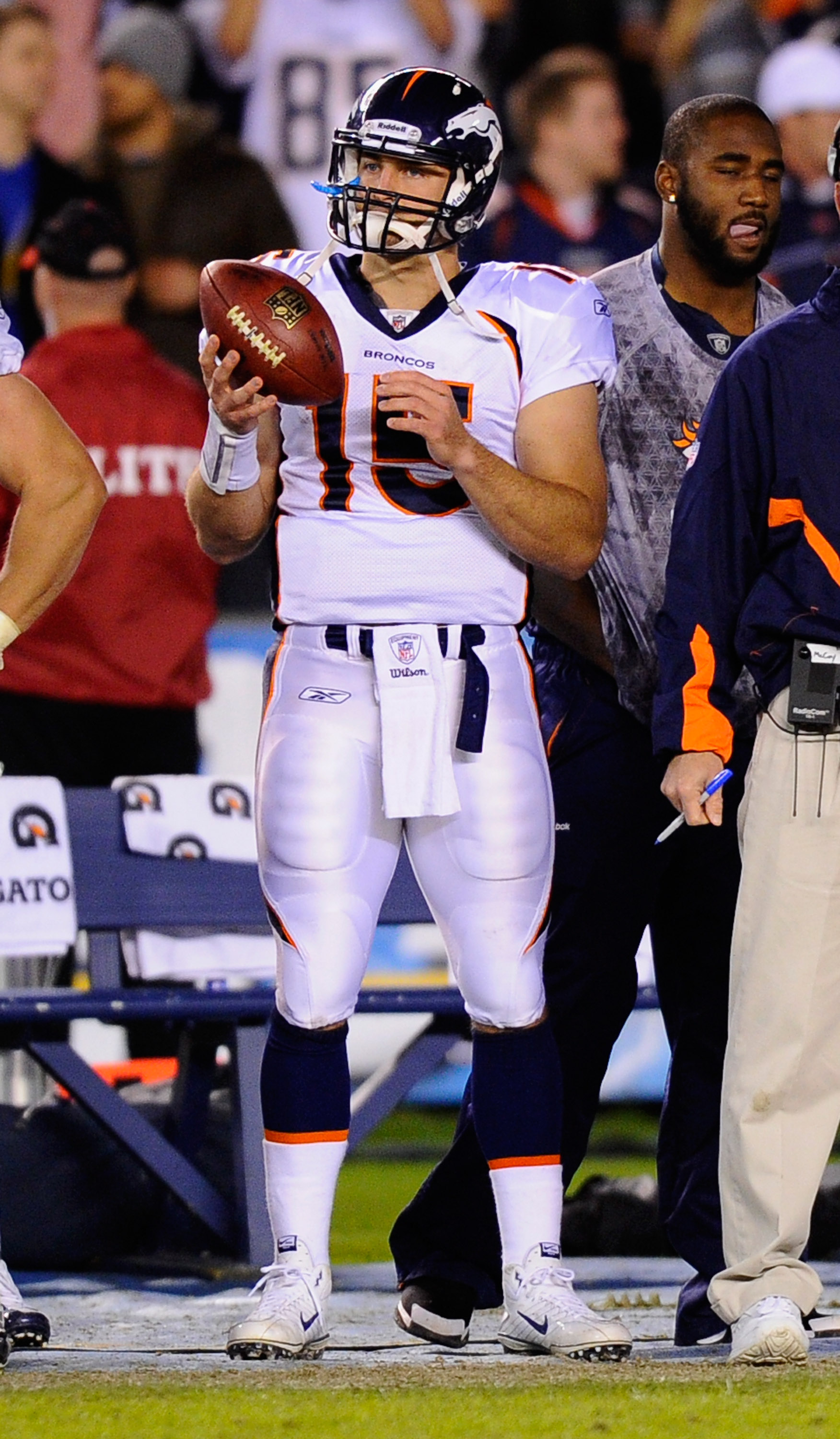 SAN DIEGO - NOVEMBER 22: Quarterback Tim Tebow #15 of the Denver Broncos tosses the footbal on the sideline during the football game against the San Diego Chargers at Qualcomm Stadium on November 22, 2010 in San Diego, California. Chargers defeated the Br