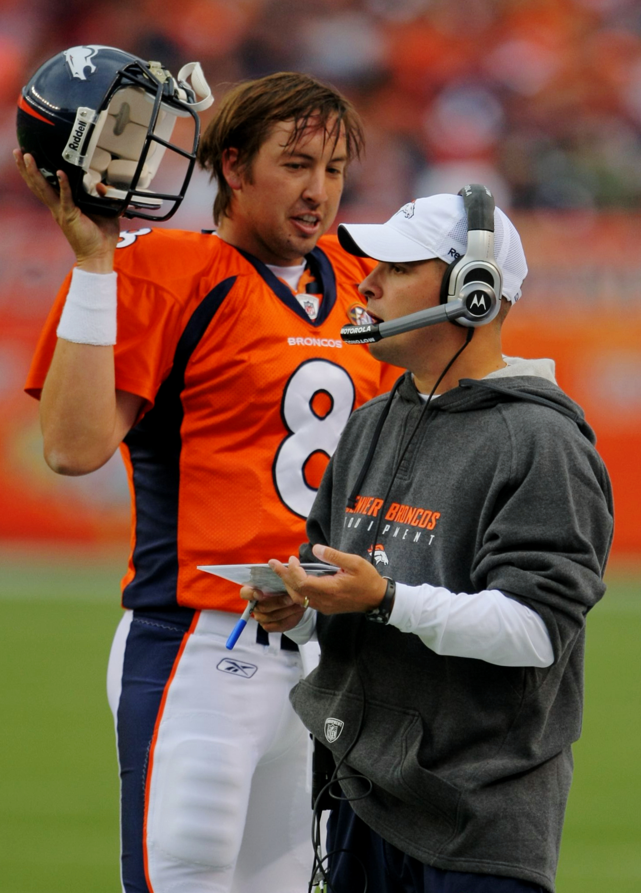 DENVER - AUGUST 30:  Head Coach Josh McDaniels (L) of the Denver Broncos talks to his quarterback Kyle Orton #8 (R) during the preseason game against the Chicago Bears at INVESCO Field at Mile High on August 30, 2009 in Denver, Colorado.  (Photo by Doug P