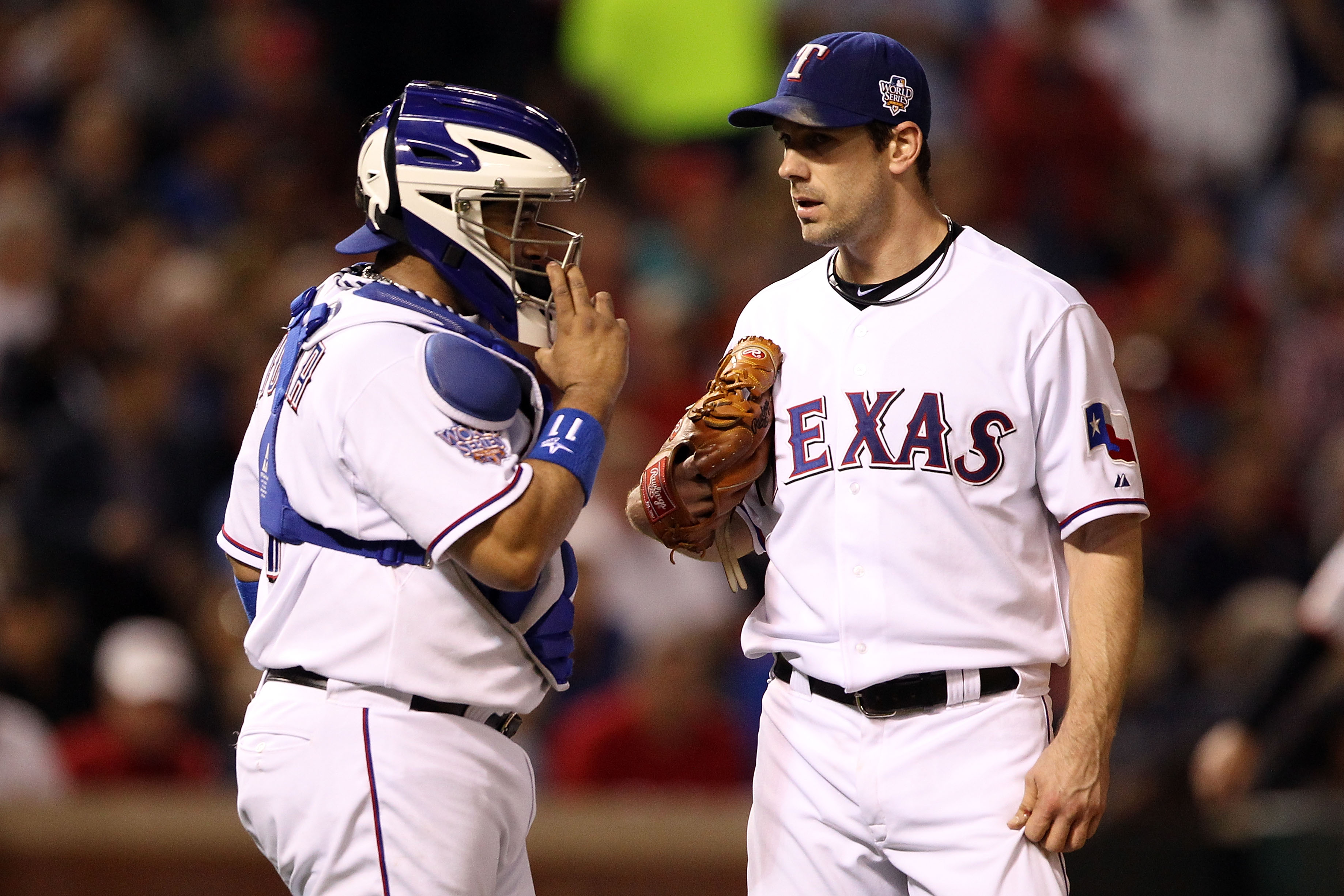 ARLINGTON, TX - NOVEMBER 01:  (L-R) Bengie Molina #11 and Cliff Lee #33 of the Texas Rangers talk on the mound against the San Francisco Giants in Game Five of the 2010 MLB World Series at Rangers Ballpark in Arlington on November 1, 2010 in Arlington, Te