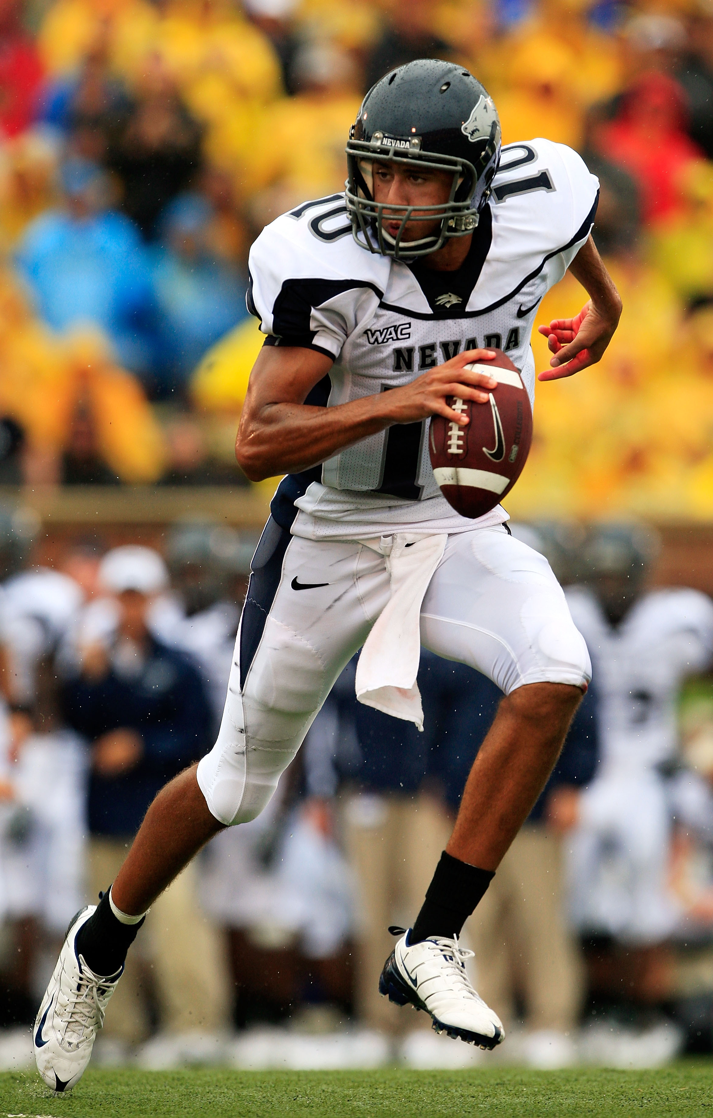 COLUMBIA, MO - SEPTEMBER 13: Quarterback Colin Kaepernick #10 of the Nevada Wolf Pack rolls out during the first half of the game against the Missouri Tigers on September 13, 2008 at Memorial Stadium in Columbia, Missouri. (Photo by Jamie Squire/Getty I