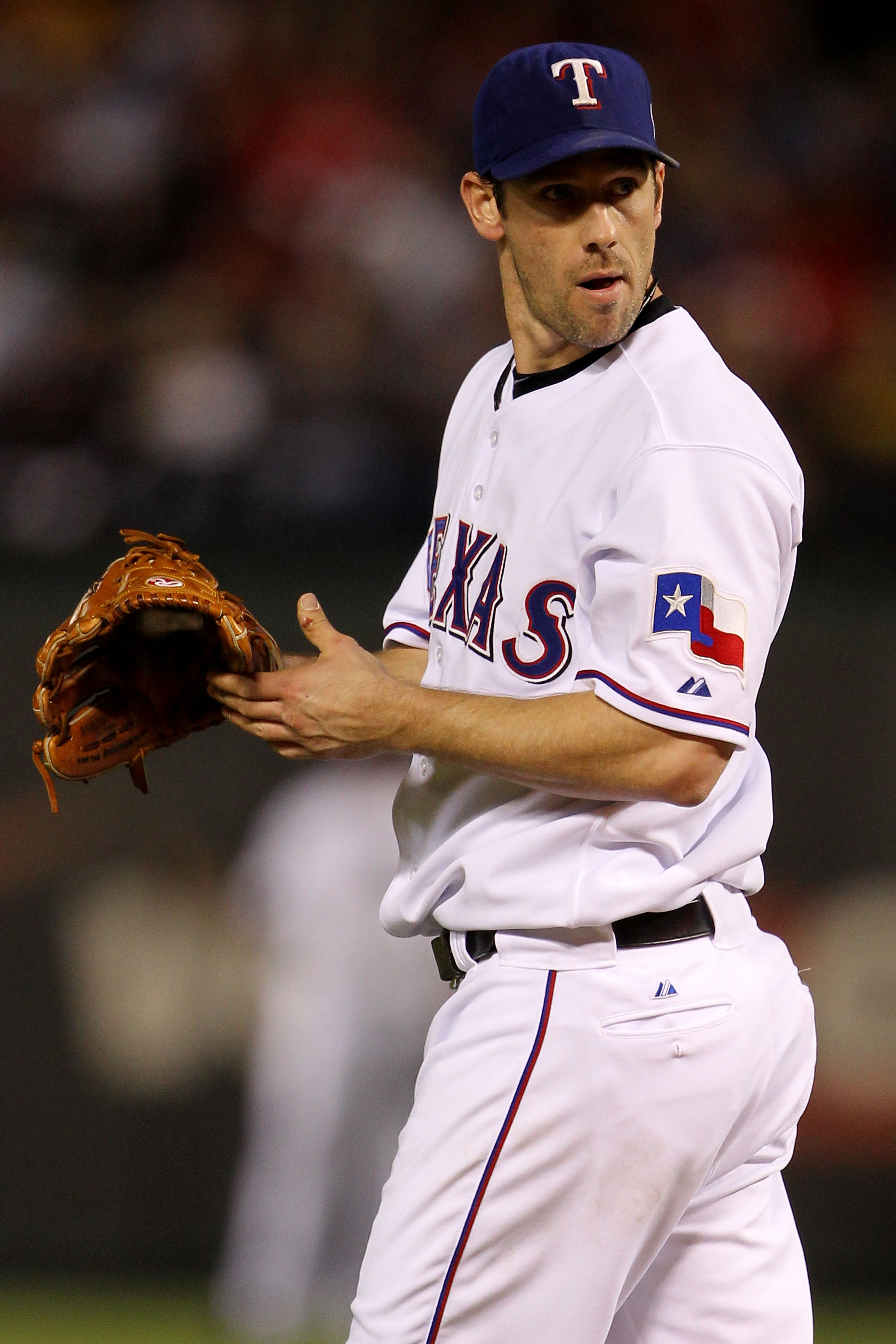 ARLINGTON, TX - NOVEMBER 01:  Cliff Lee #33 of the Texas Rangers looks on from behind the mind against the San Francisco Giants in Game Five of the 2010 MLB World Series at Rangers Ballpark in Arlington on November 1, 2010 in Arlington, Texas.  (Photo by