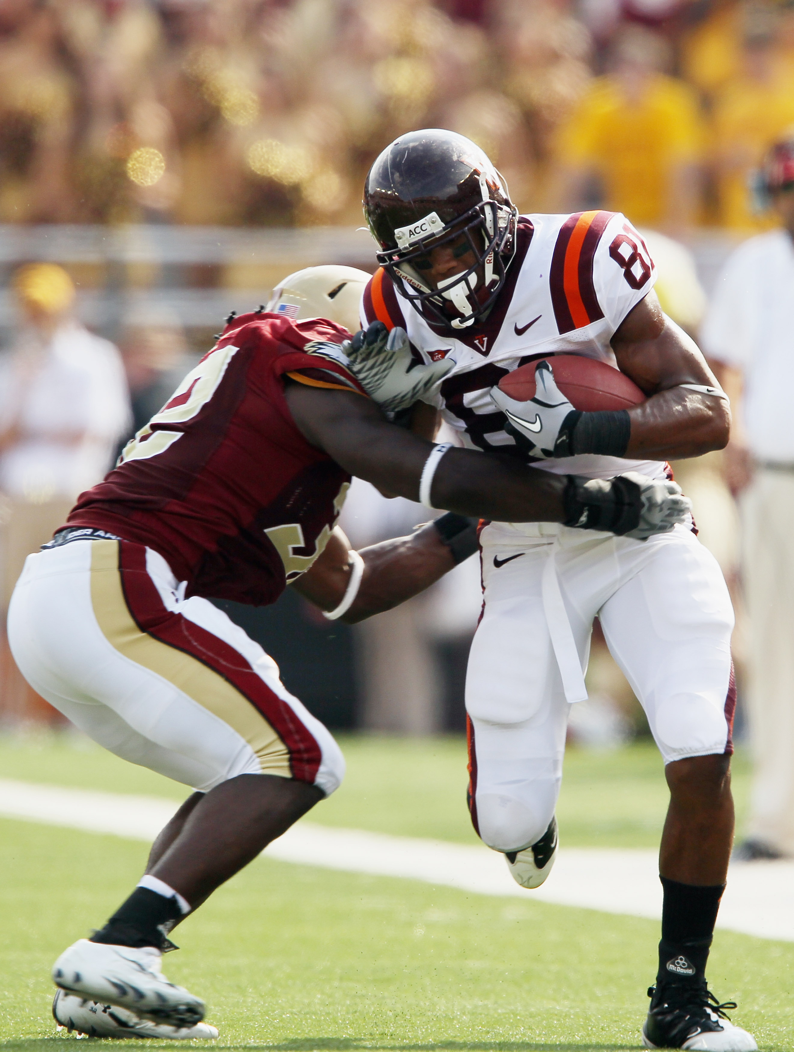 CHESTNUT HILL, MA - SEPTEMBER 25: Jarrett Boykin #81 of the Virginia Tech Hokies is tackled by Kevin Pierre-Louis #32 of the Boston College Eagles on September 25, 2010 at Alumni Stadium in Chestnut Hill, Massachusetts. Virginia Tech defeated Boston Coll