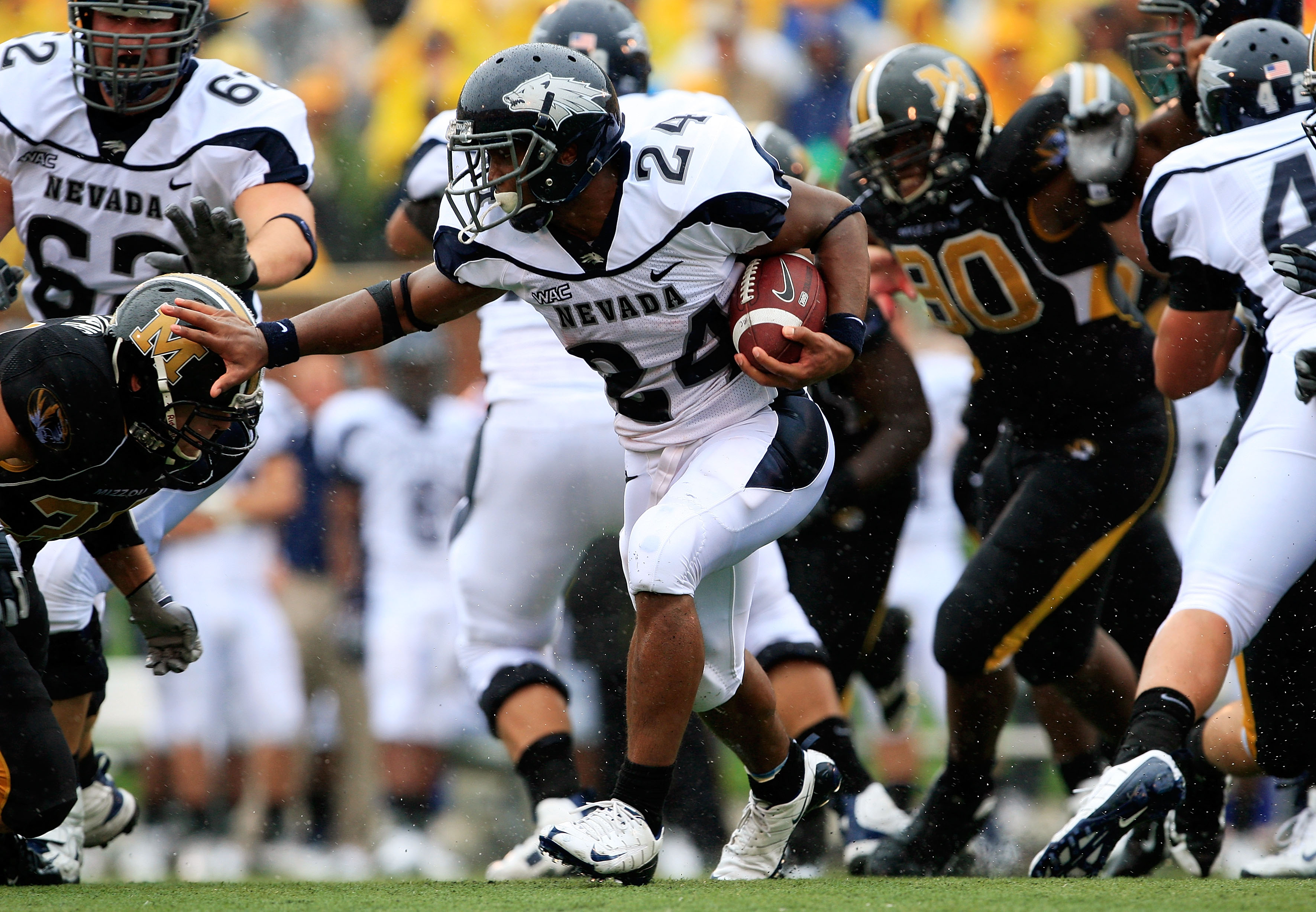 COLUMBIA, MO - SEPTEMBER 13: Vai Taua #34 the Nevada Wolf Pack carries the ball during the first half of the game against the Missouri Tigers on September 13, 2008 at Memorial Stadium in Columbia, Missouri. (Photo by Jamie Squire/Getty Images)