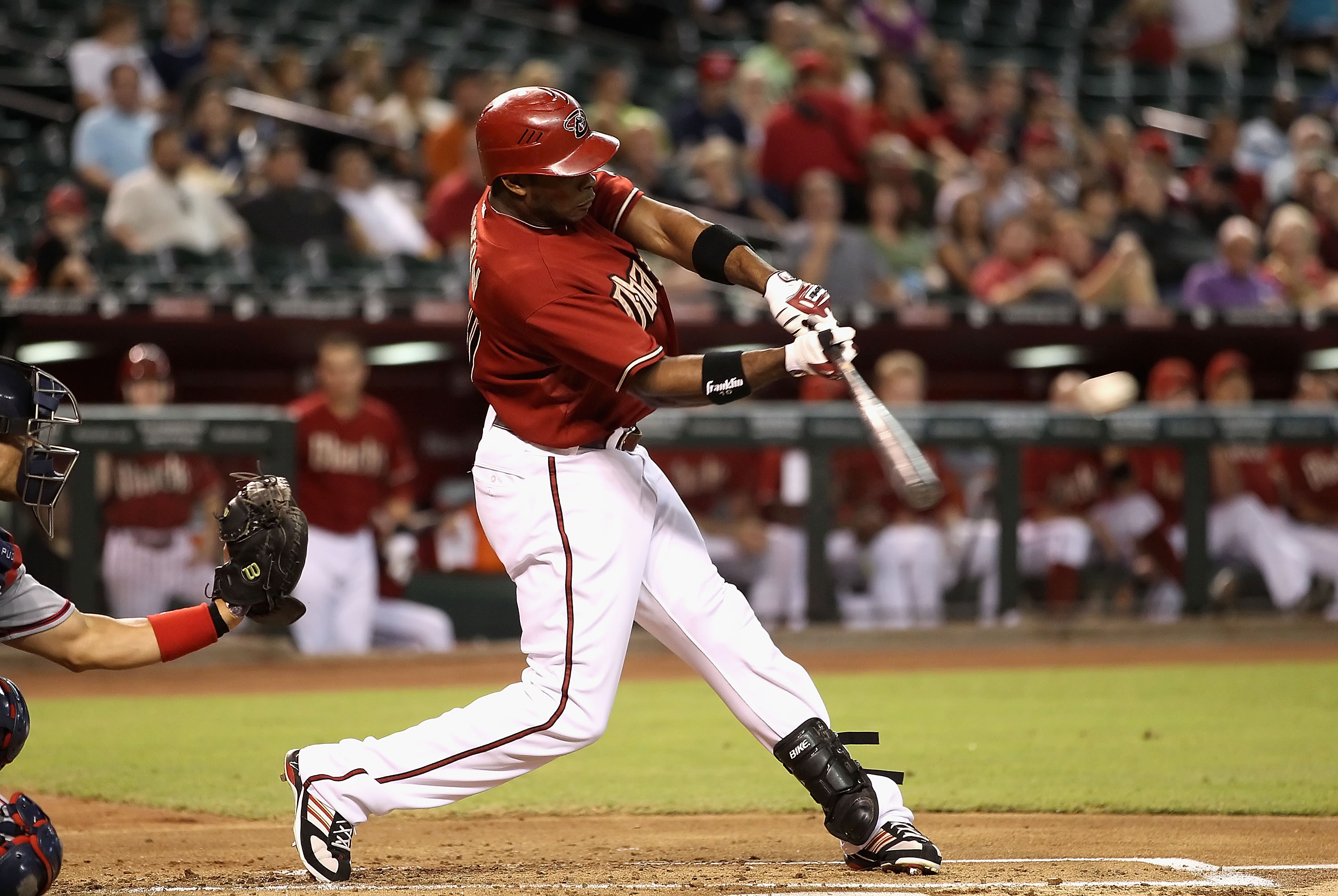 PHOENIX - AUGUST 04:  Justin Upton #24 of the Arizona Diamondbacks hits a RBI single against the Washington Nationals during the first inning of the Major League Baseball game at Chase Field on August 4, 2010 in Phoenix, Arizona.  (Photo by Christian Pete