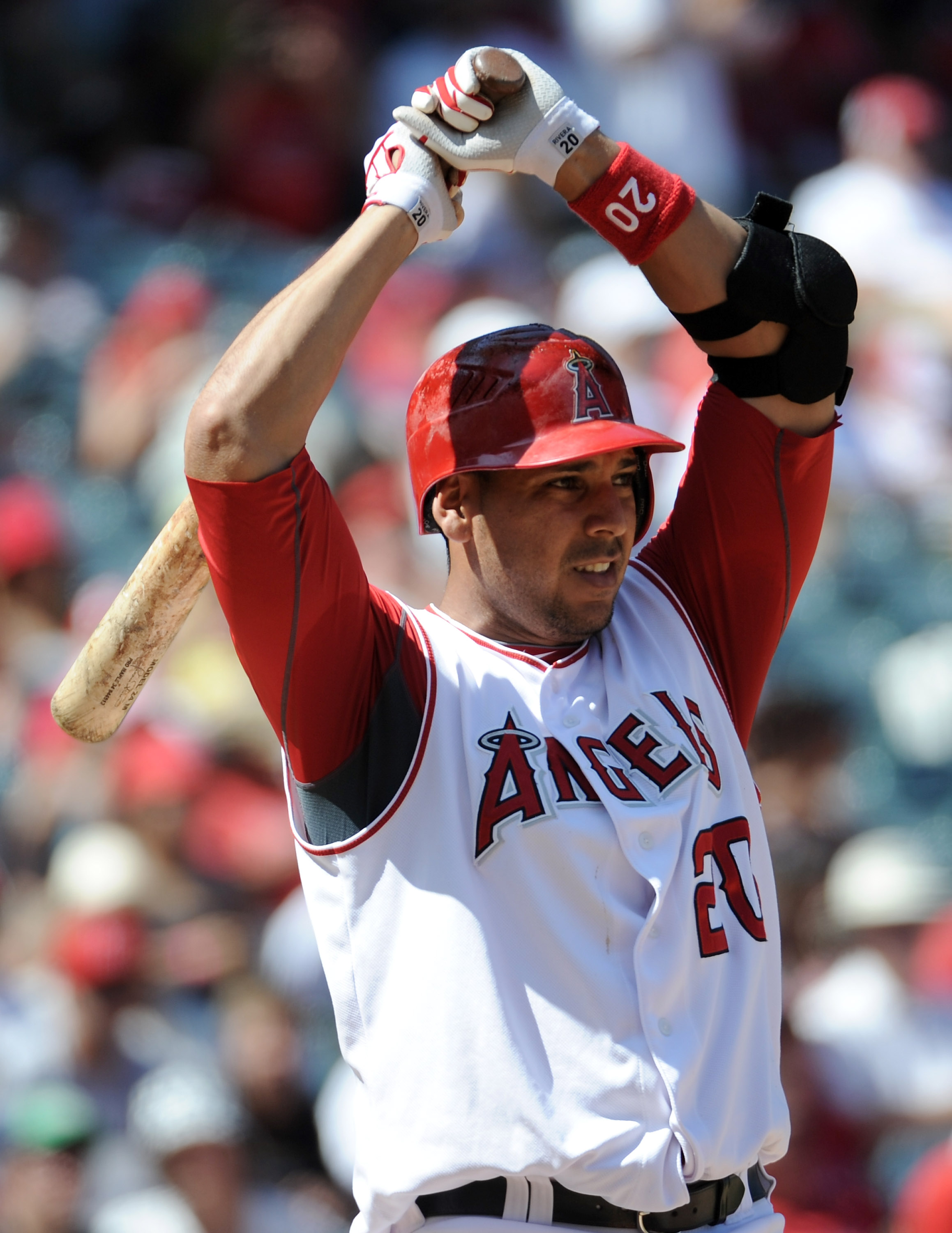 ANAHEIM, CA - SEPTEMBER 12:  Juan Rivera #20 of the Los Angeles Angels of Anaheim react to an inside pitch against the Seattle Mariners during the game at Angel Stadium on September 12, 2010 in Anaheim, California.  (Photo by Harry How/Getty Images)