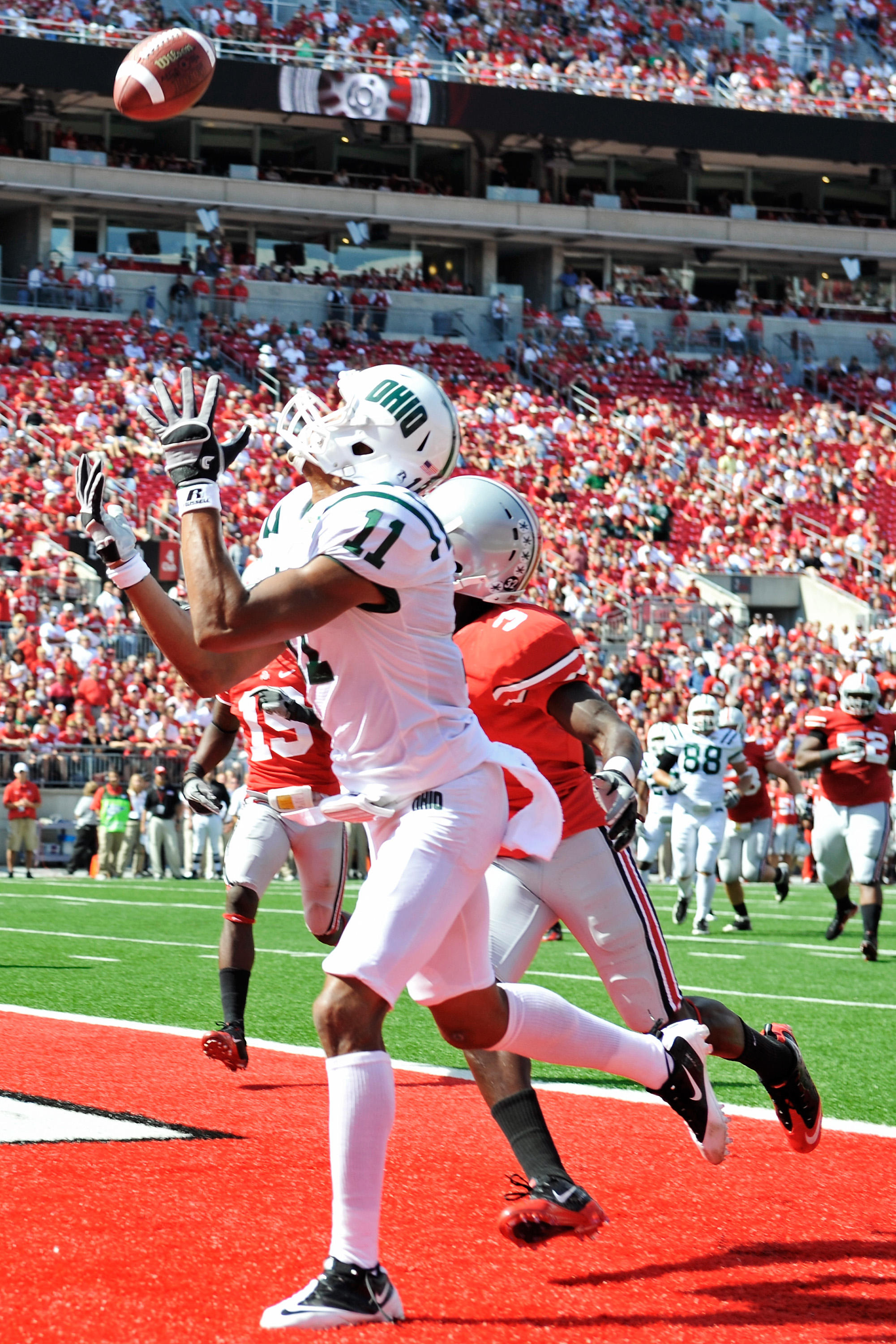 COLUMBUS, OH - SEPTEMBER 18: Terrence McCrae #11of the Ohio Bobcats catches a touchdown pass in the fourth quarter as Corey Brown #3 of the Ohio State Buckeyes defends at Ohio Stadium on September 18, 2010 in Columbus, Ohio. Ohio State defeated Ohio 43-7