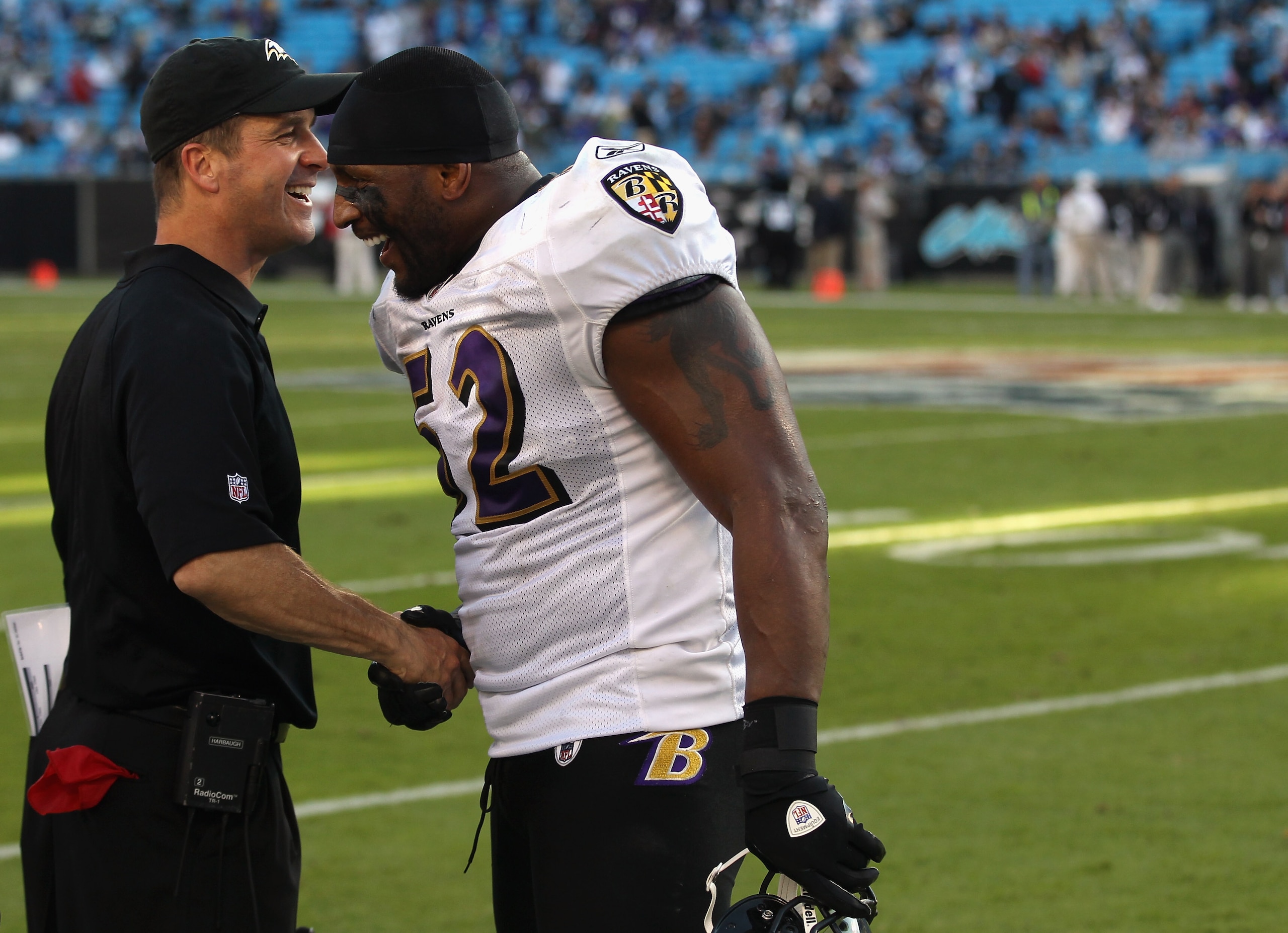 CHARLOTTE, NC - NOVEMBER 21:  Head coach John Harbaugh and Ray Lewis #52 of the Baltimore Ravens shake hands after defeating the Carolina Panthers 37-13 at Bank of America Stadium on November 21, 2010 in Charlotte, North Carolina.  (Photo by Streeter Leck