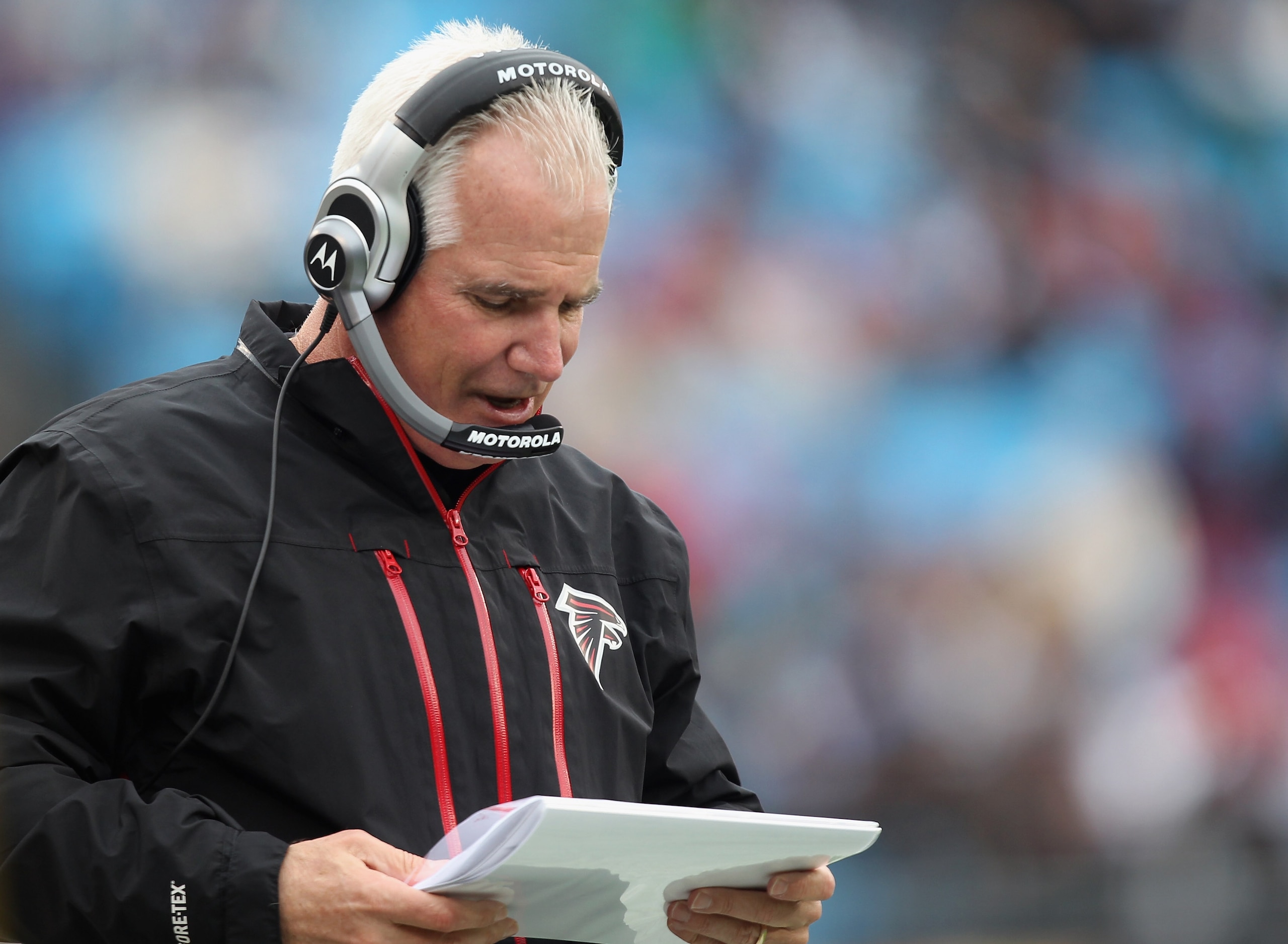 CHARLOTTE, NC - DECEMBER 12:  Head coach Mike Smith of the Atlanta Falcons calls a play against the Carolina Panthers during their game at Bank of America Stadium on December 12, 2010 in Charlotte, North Carolina.  (Photo by Streeter Lecka/Getty Images)