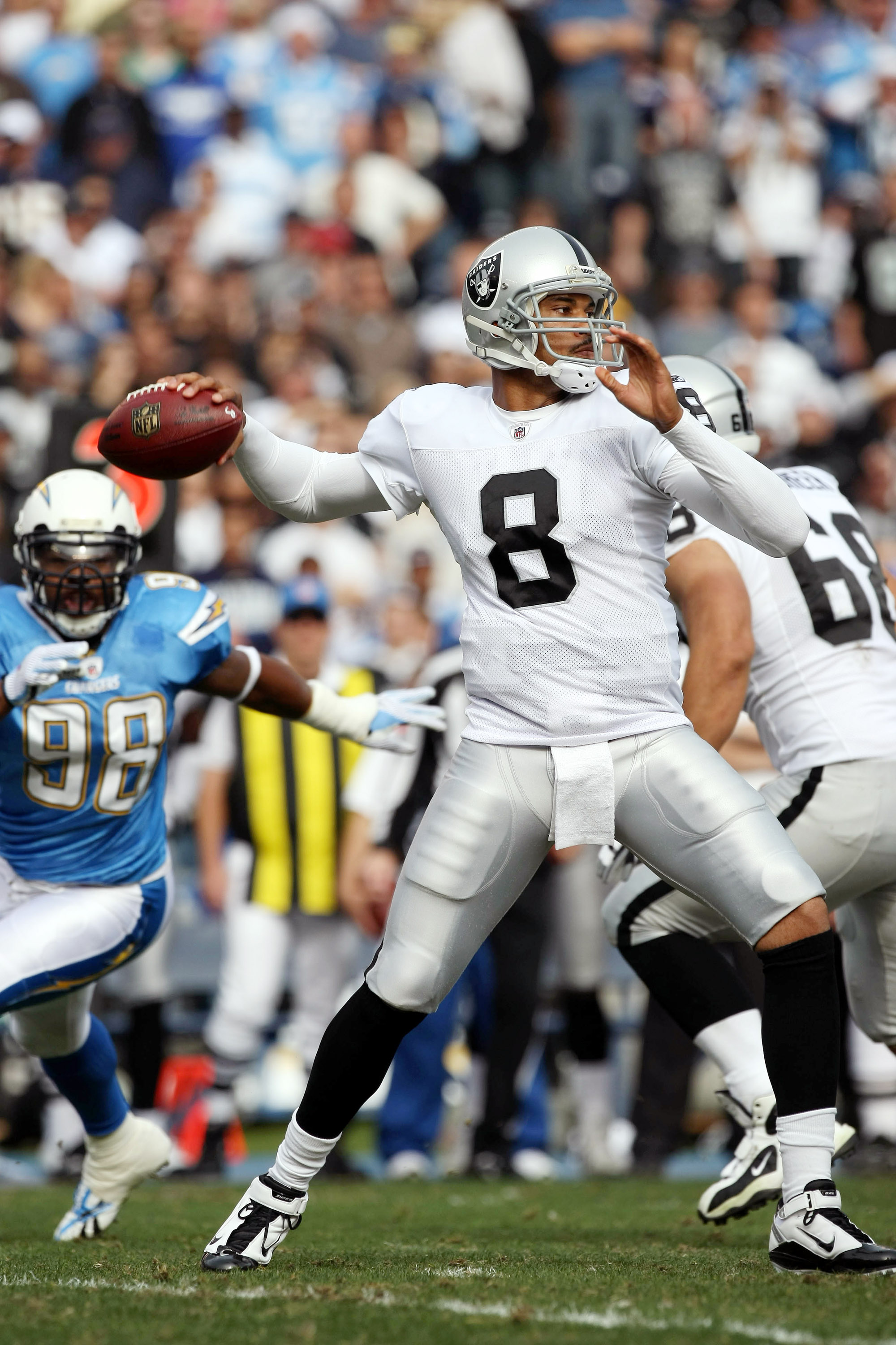 SAN DIEGO - DECEMBER 5: Quarterback Jason Campbell #8 of the Oakland Raiders throws the ball from the pocket against the San Diego Chargers during their NFL game at Qualcomm Stadium on December 5, 2010 in San Diego, California. (Photo by Donald Miralle/Ge