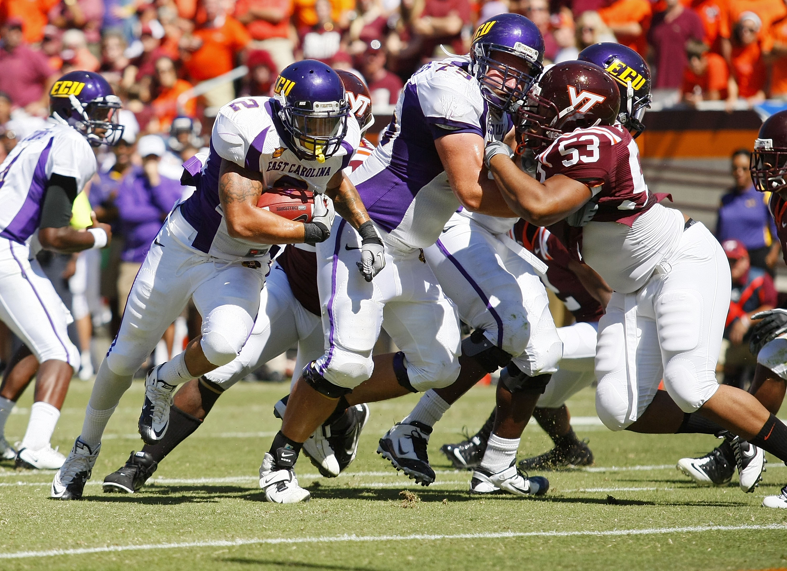 BLACKSBURG, VA - SEPTEMBER 18: Running back Giavanni Ruffin #1 of the East Carolina Pirates runs with the ball for a touchdown past defensive tackle Dwight Tucker #53 of the Virginia Tech Hokies at Lane Stadium on September 18, 2010 in Blacksburg, Virgin