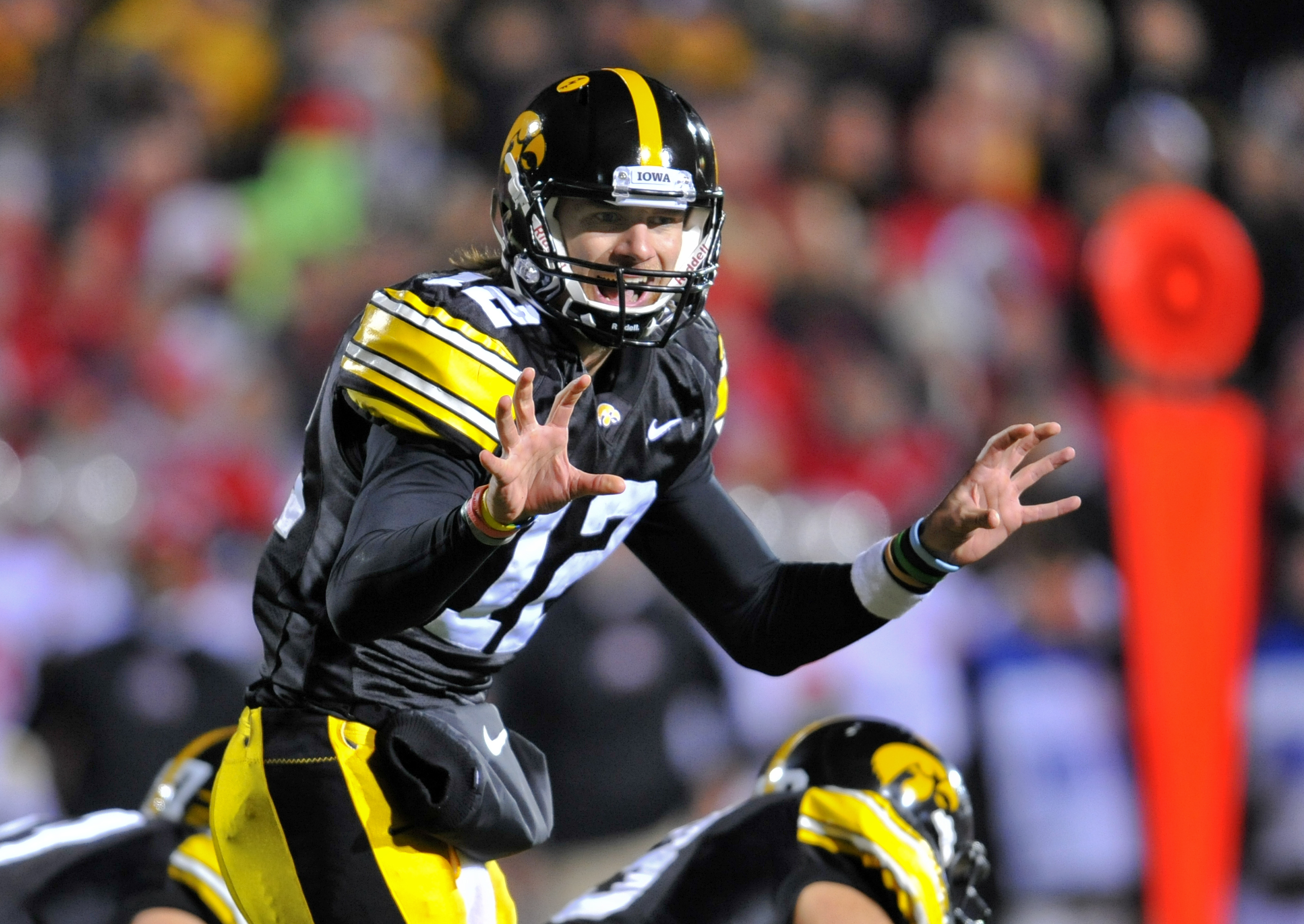 IOWA CITY, IA - NOVEMBER 20:  Quarterback Ricky Stanzi #12 of the University of Iowa Hawkeyes signals a call at the line during second half action against the Ohio State Buckeyes at Kinnick Stadium on November 20, 2010 in Iowa City, Iowa. Ohio State won 2