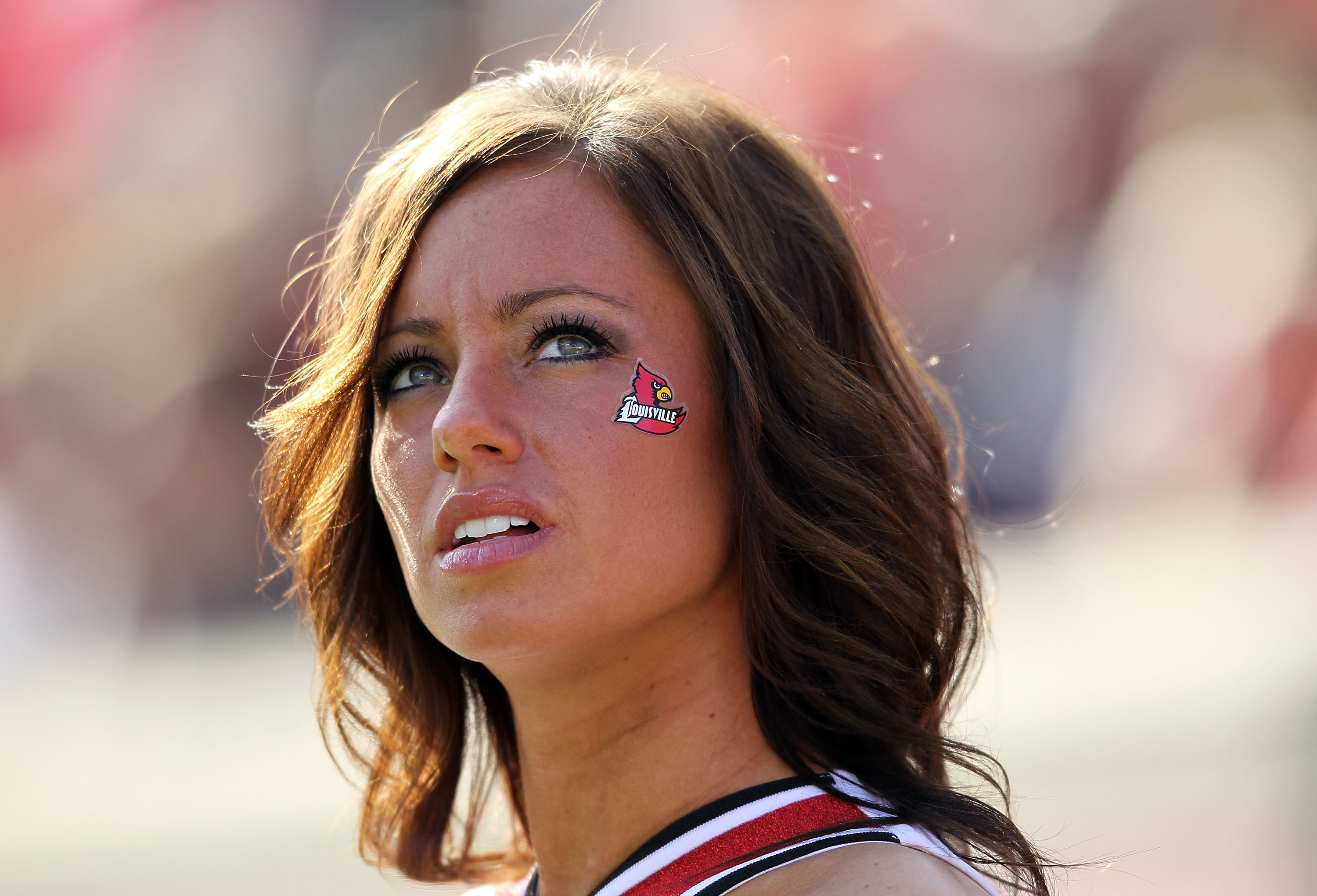 LOUISVILLE, KY - NOVEMBER 20:  A Louisville Cardinals cheerleader watches the Big East Conference game against the West Virginia Mountaineers at Papa John's Cardinal Stadium on November 20, 2010 in Louisville, Kentucky.  (Photo by Andy Lyons/Getty Images)