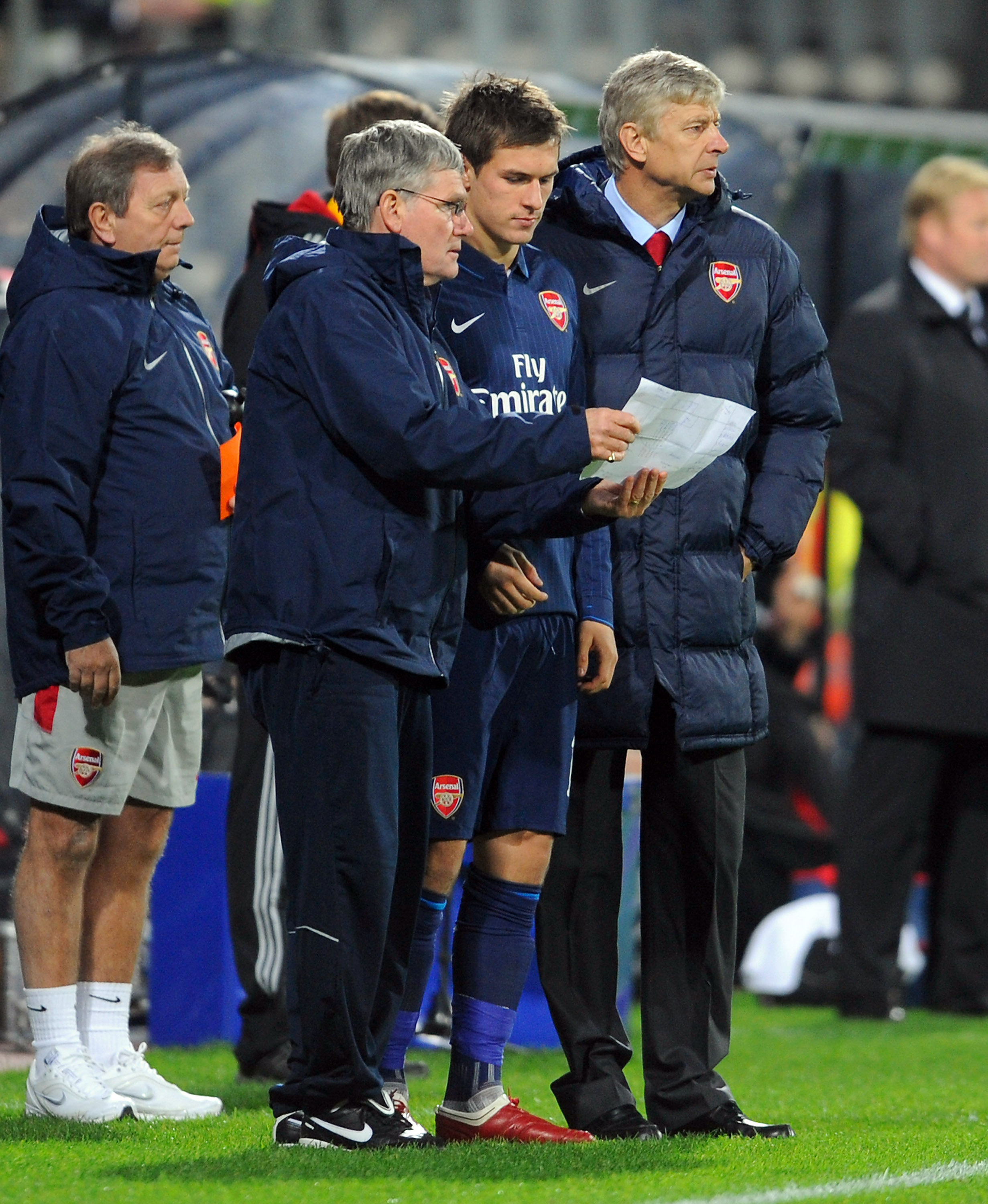 ALKMAAR, NETHERLANDS - OCTOBER 20: Arsenal's Pat Rice and Arsene Wenger give instructions to Aaron Ramsey before sending him on as a substitute during the UEFA Champions League Group H match between AZ Alkmaar and Arsenal at the DSB Stadium on October 20,