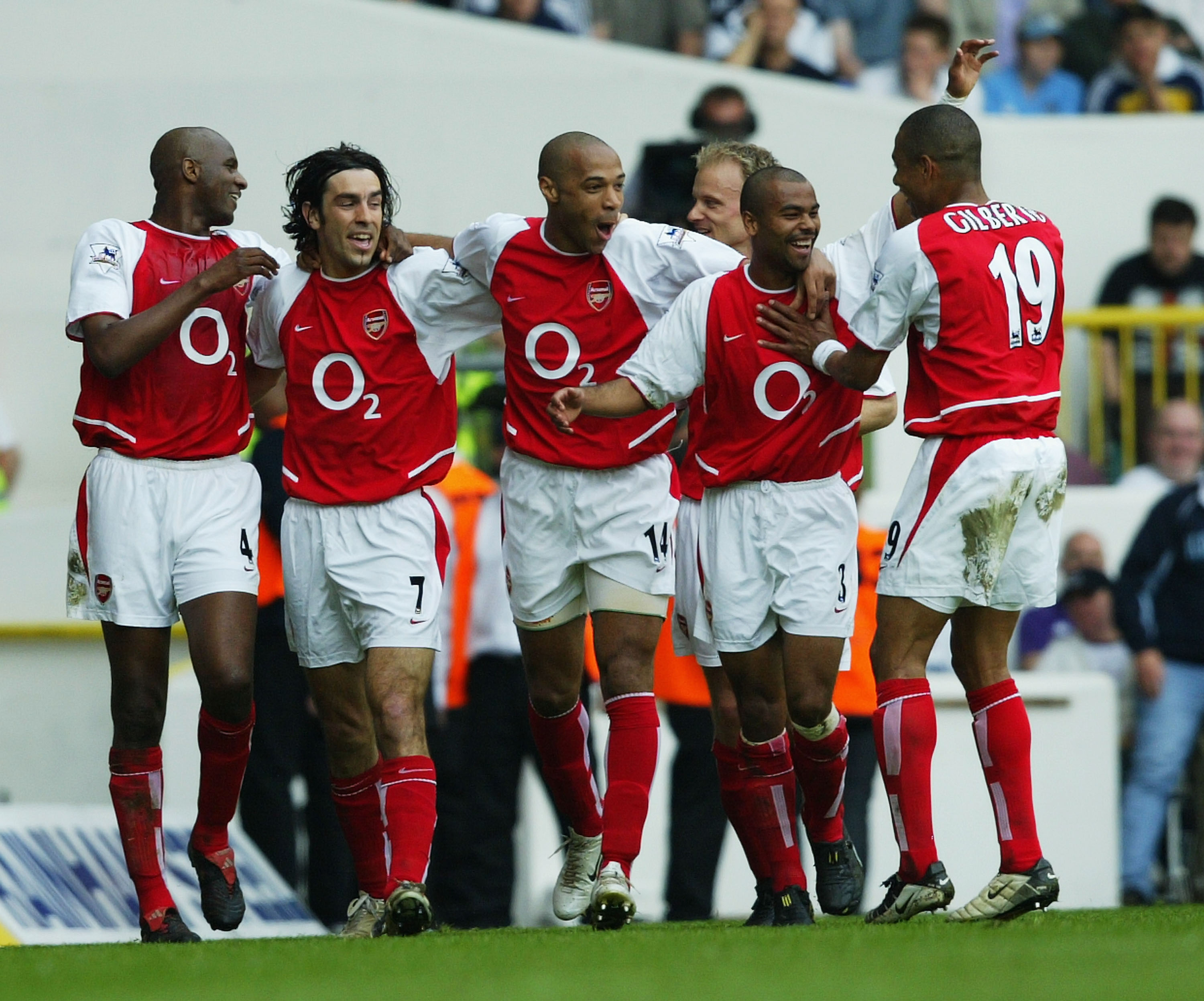 LONDON - APRIL 25: Patrick Vieira, Robert Pires, Thierry Henry, Ashley Cole and Gilberto Silva of Arsenal celebrate after the second goal during the FA Barclaycard Premiership match between Tottenham Hotspur and Arsenal at White Hart Lane on April 25, 200