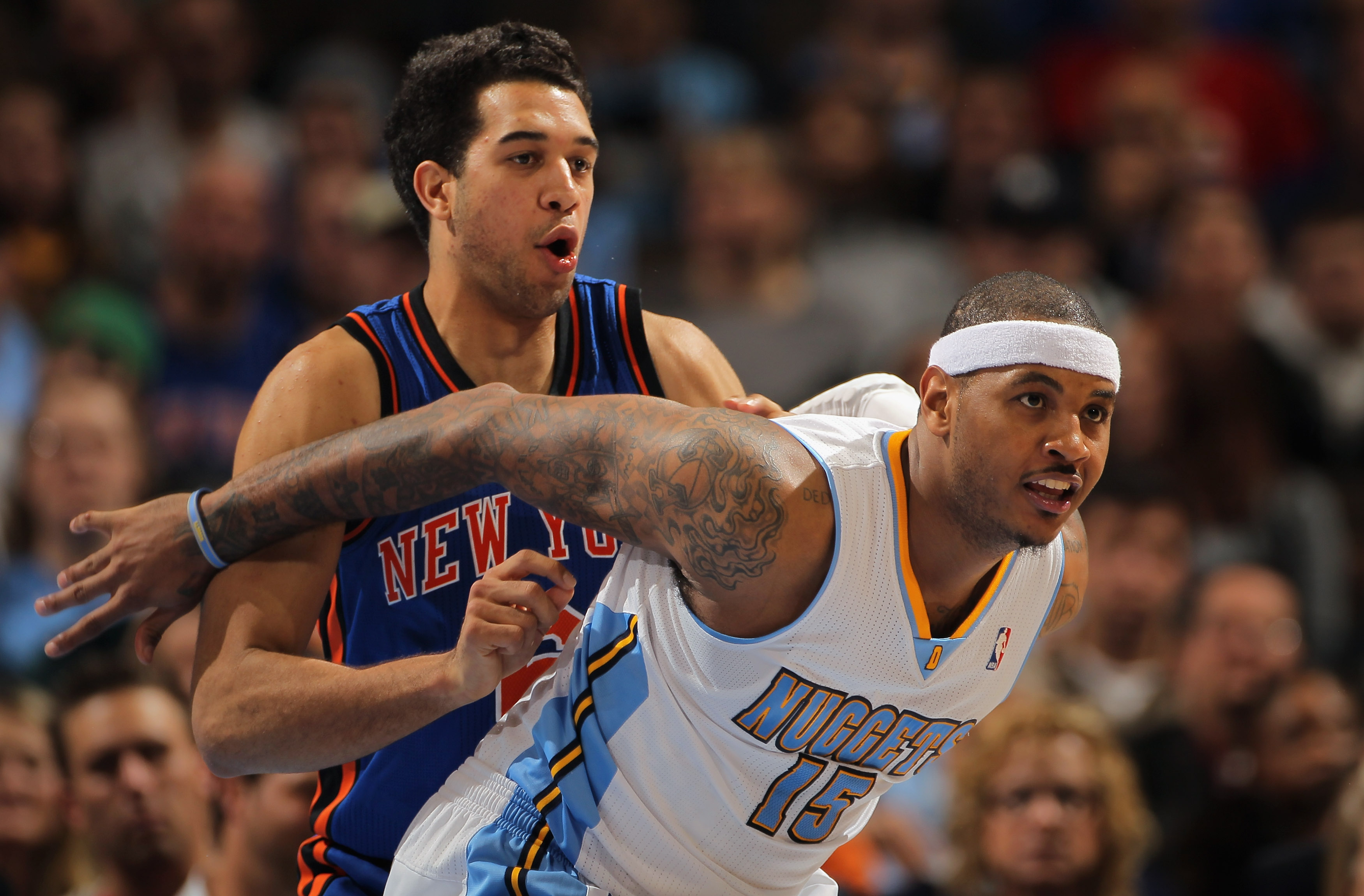 DENVER - NOVEMBER 16:  Carmelo Anthony #15 of the Denver Nuggets fights for position with Landry Fields #6 of the New York Knicks at the Pepsi Center on November 16, 2010 in Denver, Colorado. NOTE TO USER: User expressly acknowledges and agrees that, by d