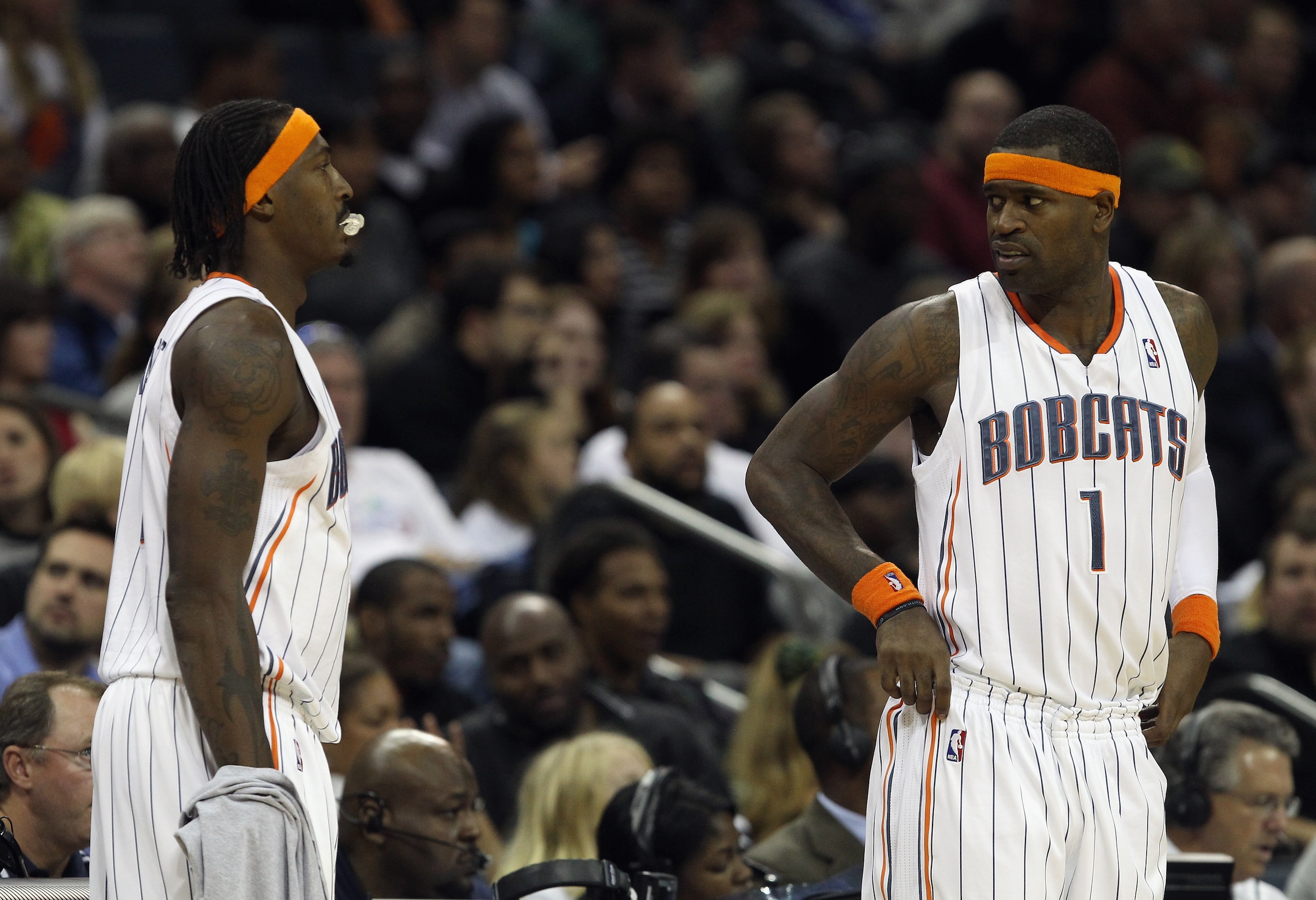 CHARLOTTE, NC - NOVEMBER 08:  Teammates Gerald Wallace #3 and Stephen Jackson #1 of the Charlotte Bobcats wait to check into the game against the San Antonio Spurs at Time Warner Cable Arena on November 8, 2010 in Charlotte, North Carolina.  NOTE TO USER: