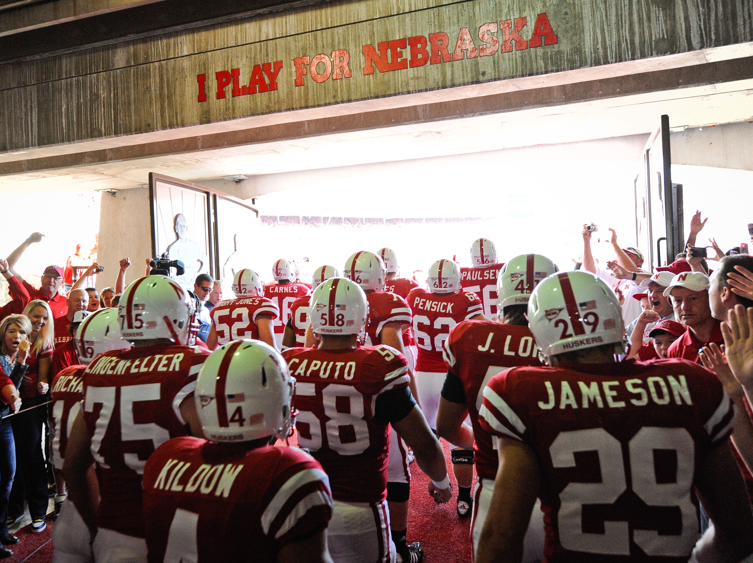 LINCOLN, NE - OCTOBER 16: The Nebraska Cornuskers run through a gauntlet of fans as they take the field against the Texas Longhorns at Memorial Stadium on October 16, 2010 in Lincoln, Nebraska. Texas Defeated Nebraska 20-13. (Photo by Eric Francis/Getty I LINCOLN, NE - OCTOBER 16: The Nebraska Cornuskers run through a gauntlet of fans as they take the field against the Texas Longhorns at Memorial Stadium on October 16, 2010 in Lincoln, Nebraska. Texas Defeated Nebraska 20-13. (Photo by Eric Francis/Getty I