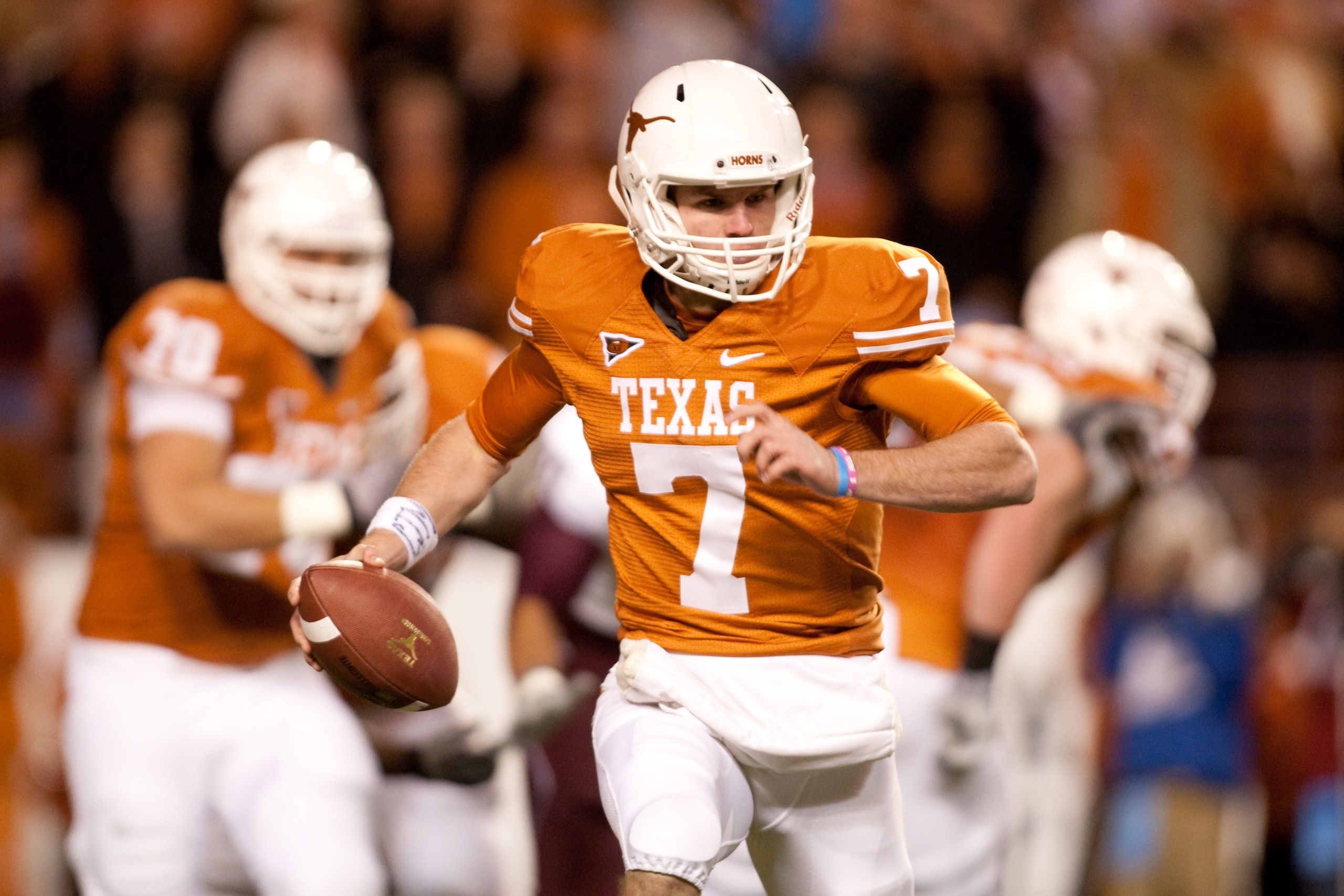 AUSTIN, TX - NOVEMBER 25: University of Texas quarterback Garrett Gilbert #8 rushes during the first half against Texas A&M at Darrell K. Royal-Texas Memorial Stadium on November 25, 2010 in Austin, Texas. (Photo by Darren Carroll/Getty Images) AUSTIN, TX - NOVEMBER 25: University of Texas quarterback Garrett Gilbert #8 rushes during the first half against Texas A&M at Darrell K. Royal-Texas Memorial Stadium on November 25, 2010 in Austin, Texas. (Photo by Darren Carroll/Getty Images)