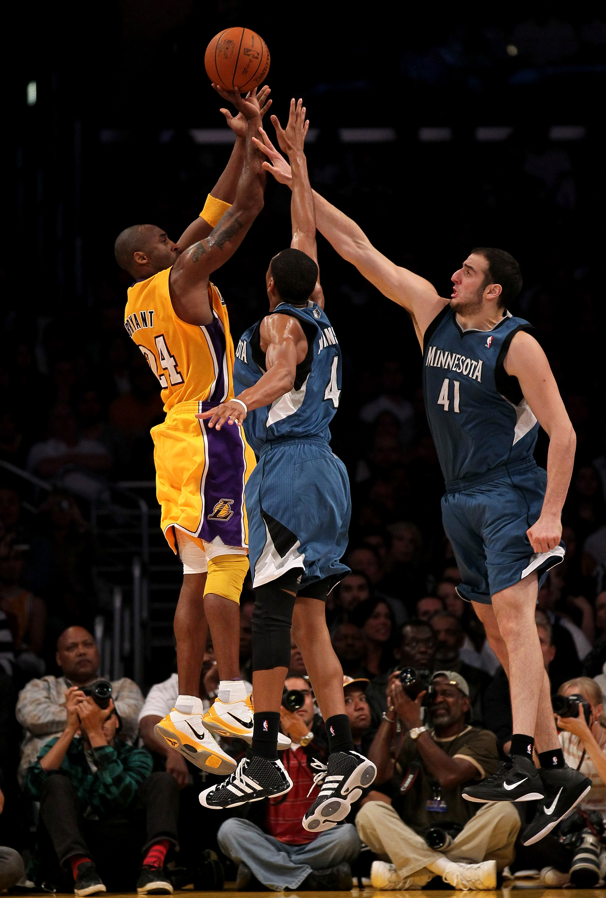 LOS ANGELES, CA - NOVEMBER 09:  Kobe Bryant #24 of the Los Angeles Lakers shoots over Wes Johnson #4 and Kosta Koufos #41 of the Minnesota Timberwolves at Staples Center on November 9, 2010 in Los Angeles, California.  The Lakers won 99-94.  NOTE TO USER: