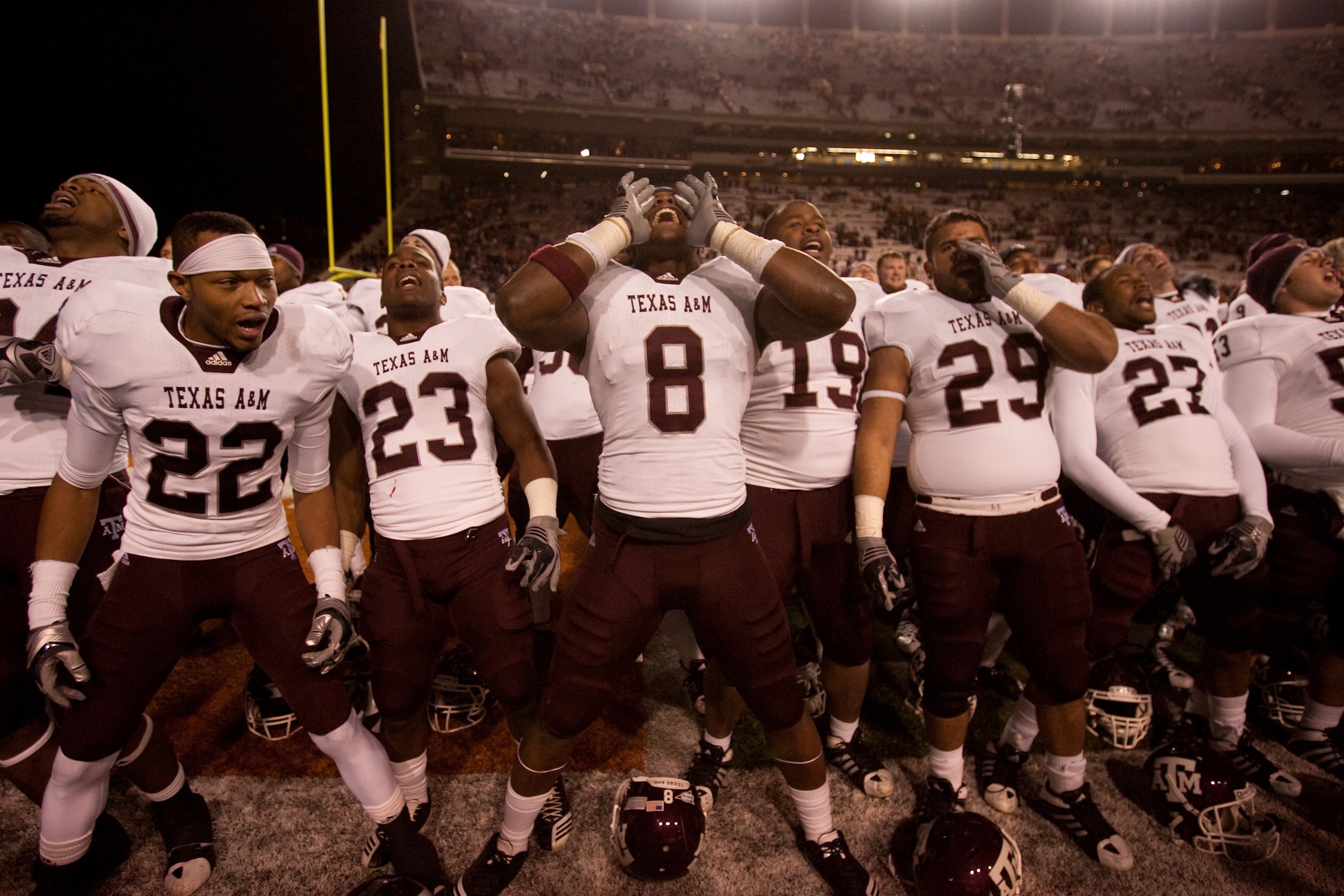 AUSTIN, TX - NOVEMBER 25: Texas A&M players (L-R) Dustin Harris #22, Ben Malena #23, Jeff Fuller #8, Michael Lamothe #19, Blane Cheatham #29, and C.J. Jones #27 celebrate Texas A&M's 24-17 win over the University of Texas at Darrell K. Royal-Texas Memori AUSTIN, TX - NOVEMBER 25: Texas A&M players (L-R) Dustin Harris #22, Ben Malena #23, Jeff Fuller #8, Michael Lamothe #19, Blane Cheatham #29, and C.J. Jones #27 celebrate Texas A&M's 24-17 win over the University of Texas at Darrell K. Royal-Texas Memori