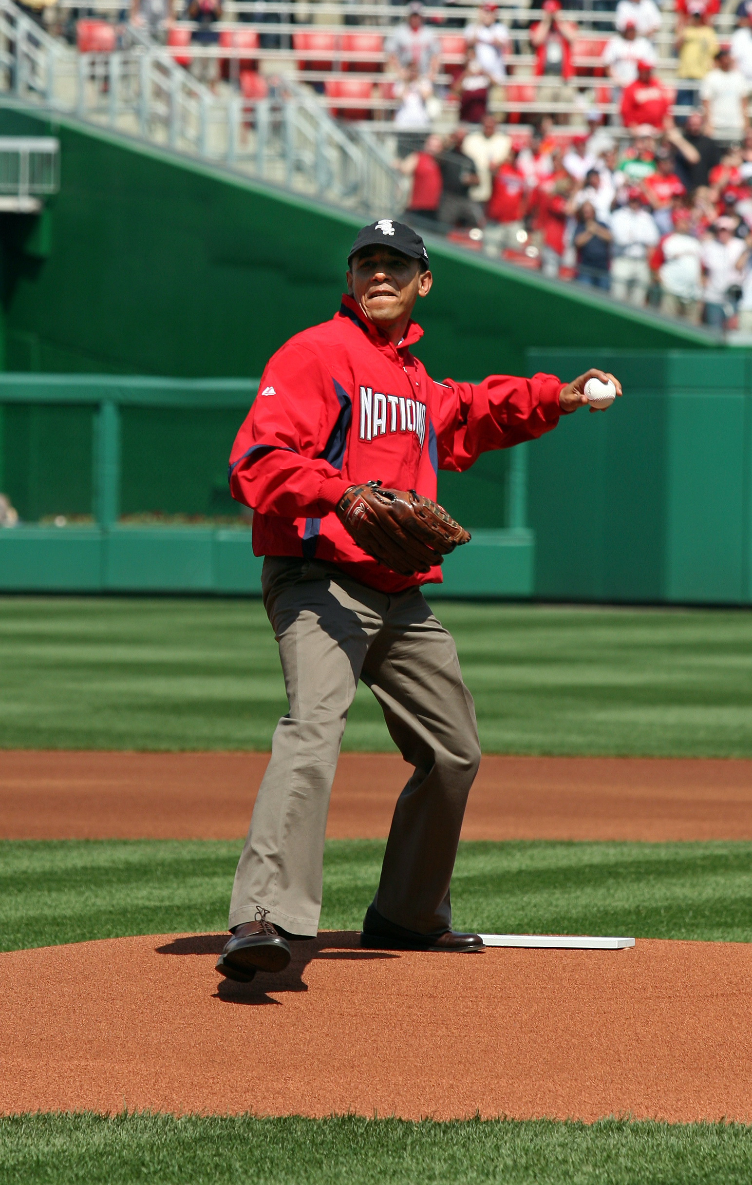 WASHINGTON - APRIL 05:  U.S. President Barack Obama throws out the opening pitch before the game between the Philadelphia Phillies and the Washington Nationals on Opening Day at Nationals Park on April 5, 2010 in Washington, DC.  (Photo by Martin H. Simon