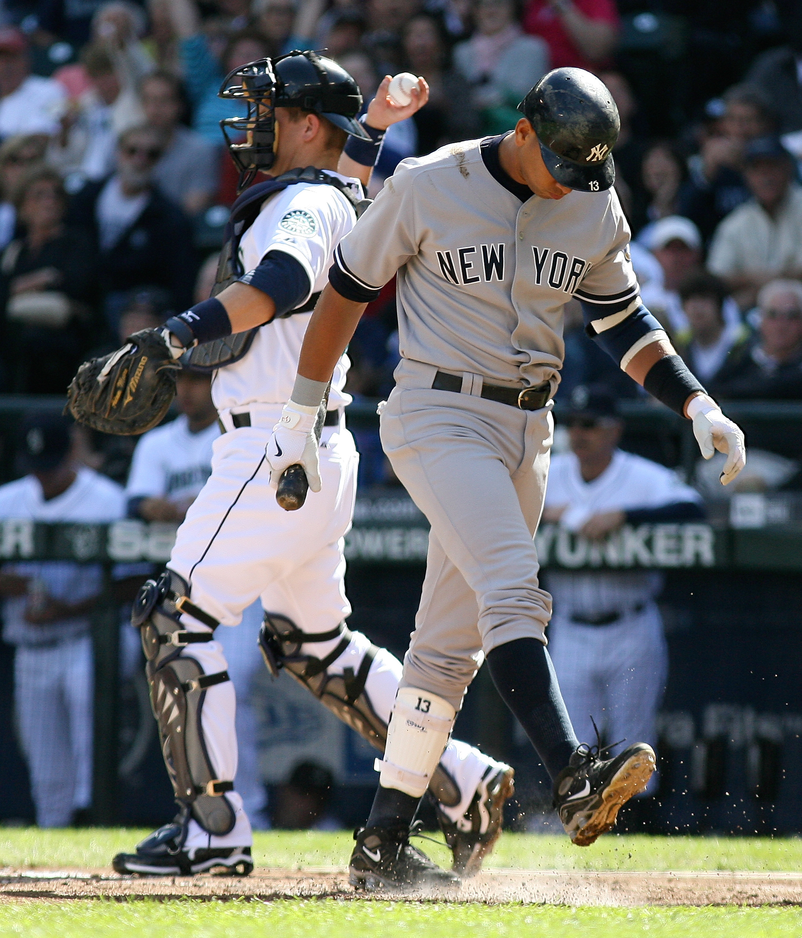 SEATTLE - SEPTEMBER 20:  Alex Rodriguez #13 of the New York Yankees heads back to the dugout after striking out against the Seattle Mariners as catcher Adam Moore #50 throws the ball back to the pitcher on September 20, 2009 at Safeco Field in Seattle, Wa