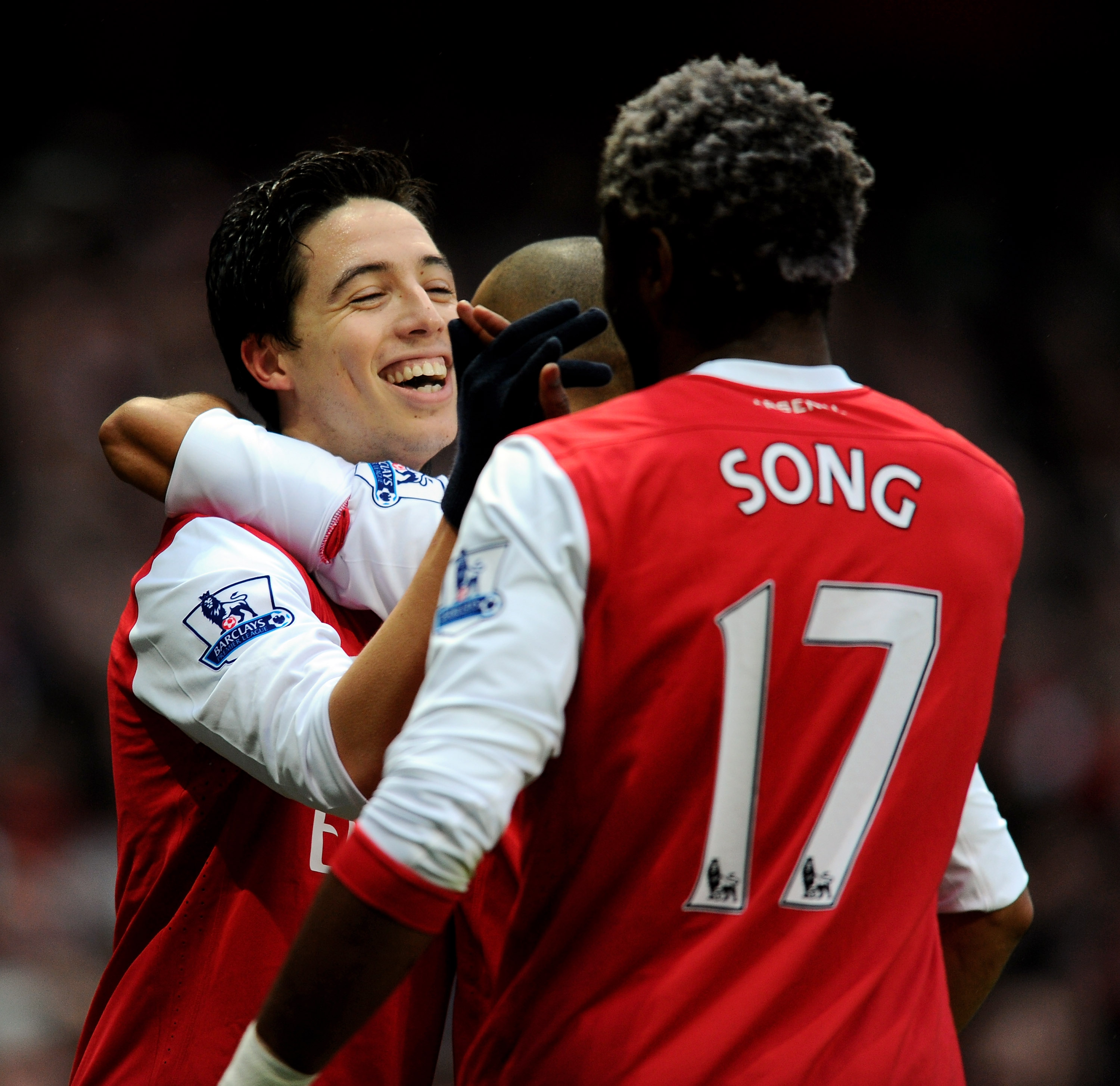 LONDON, ENGLAND - DECEMBER 04:  Samir Nasri (L) of Arsenal is congratulated by teammate Alex Song  after scoring the opening goal during the Barclays Premier League match between Arsenal and Fulham at the Emirates Stadium on December 4, 2010 in London, En