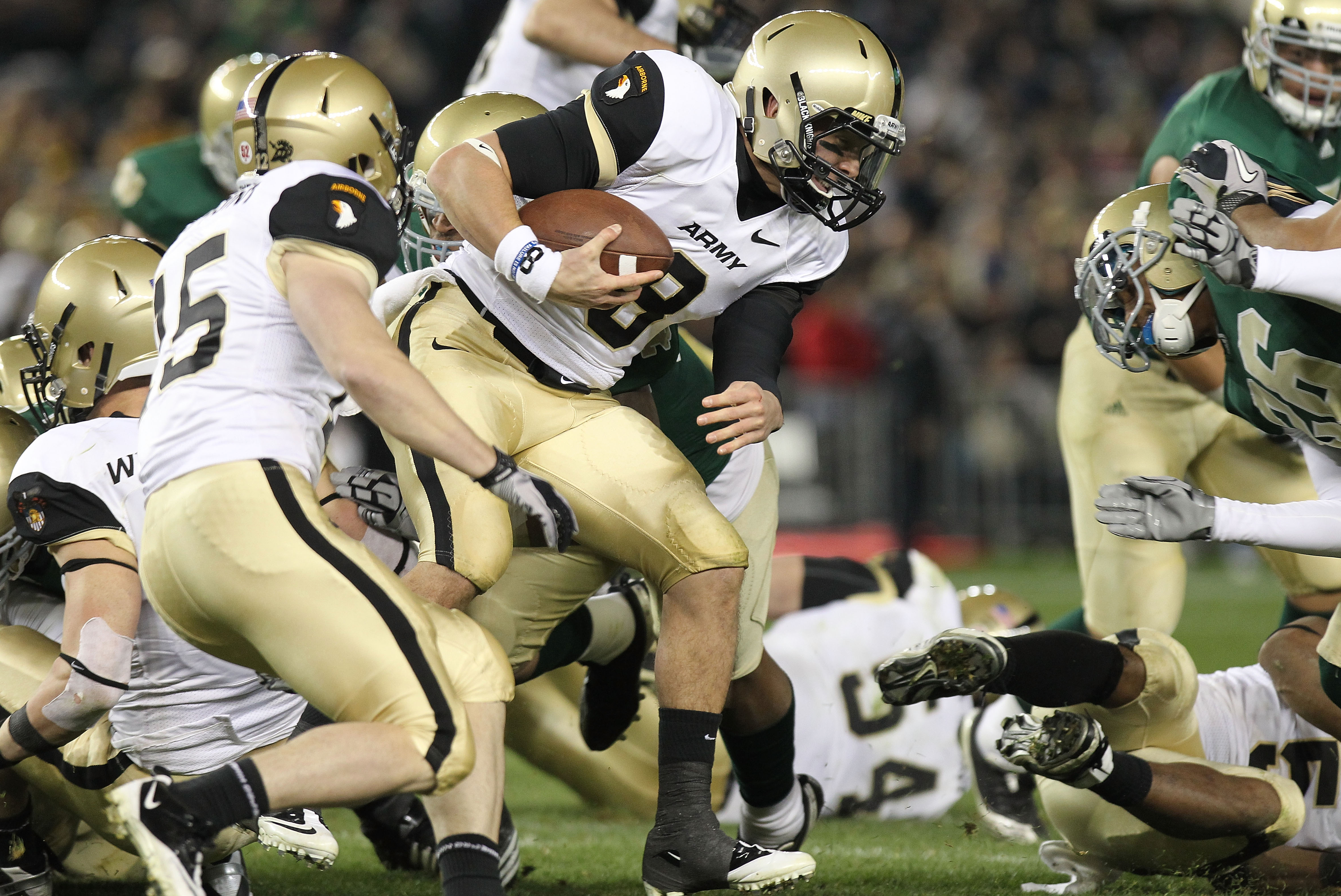 NEW YORK - NOVEMBER 20: Trent Steelman #8 of the Army Black Knights is tackled against the Notre Dame Fighting Irish at Yankee Stadium on November 20, 2010 in the Bronx borough of New York City. (Photo by Nick Laham/Getty Images)