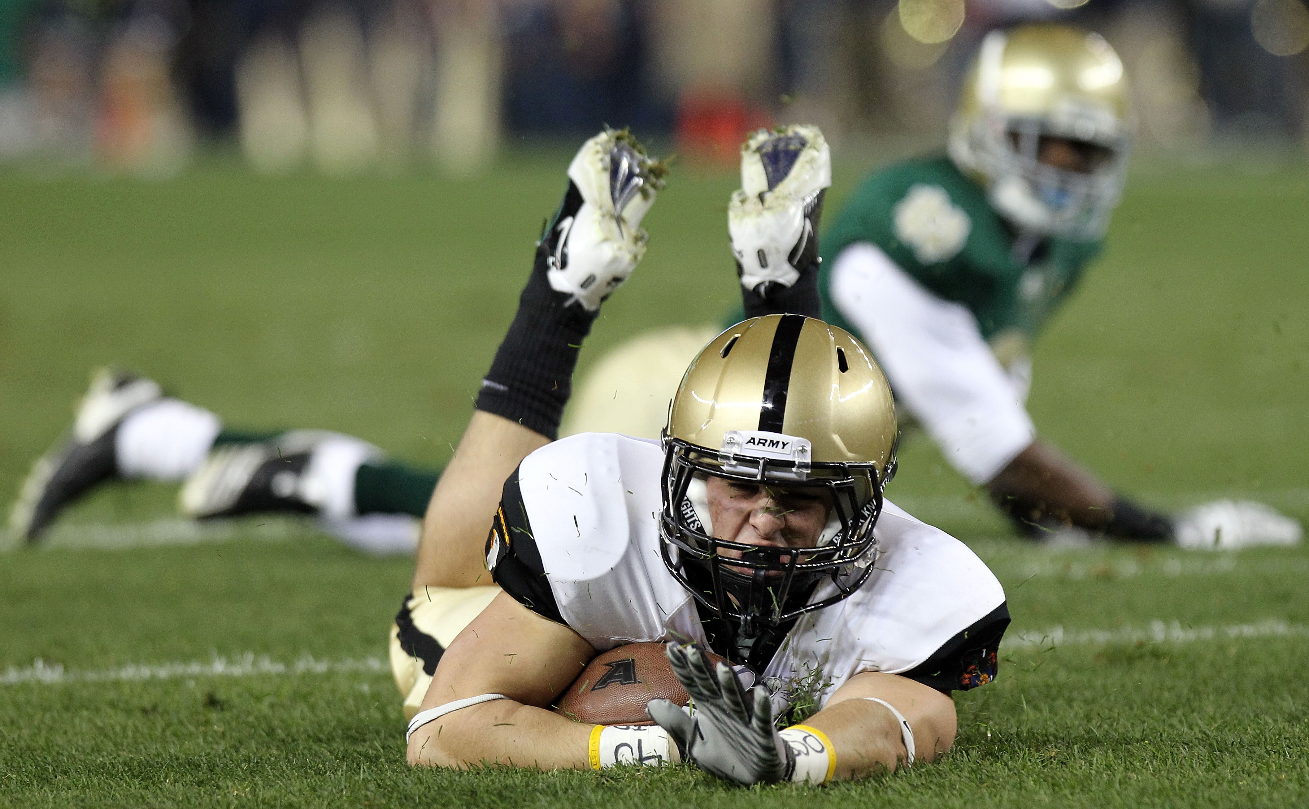 NEW YORK - NOVEMBER 20: Jonathan Crucitti #36 of the Army Black Knights falls to the ground against the Notre Dame Fighting Irish at Yankee Stadium on November 20, 2010 in the Bronx borough of New York City. (Photo by Nick Laham/Getty Images)