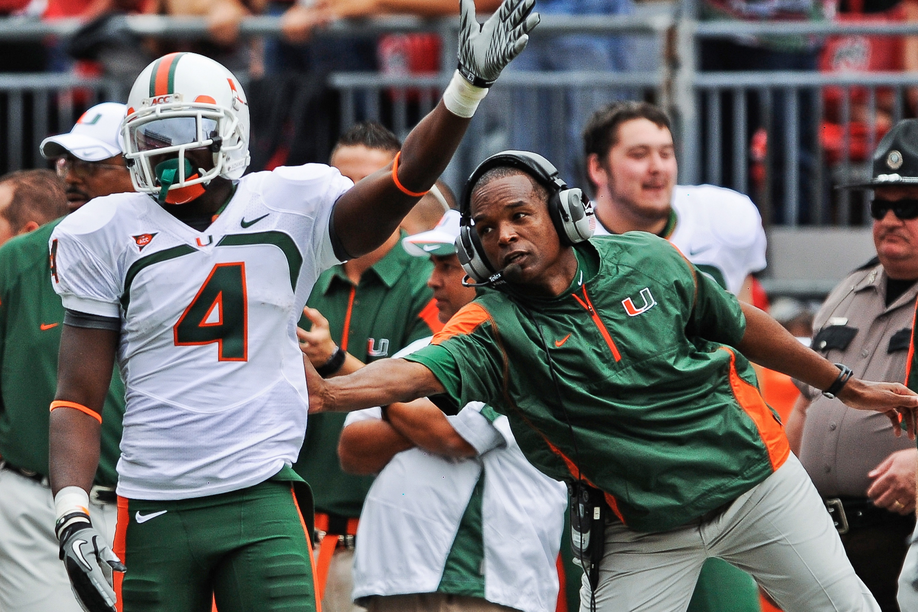 COLUMBUS, OH - SEPTEMBER 11:  Head Coach Randy Shannon of the Miami Hurricanes congratulates Aldarius Johnson #4 of the Hurricanes after a first down catch against the Ohio State Buckeyes at Ohio Stadium on September 11, 2010 in Columbus, Ohio.  (Photo by
