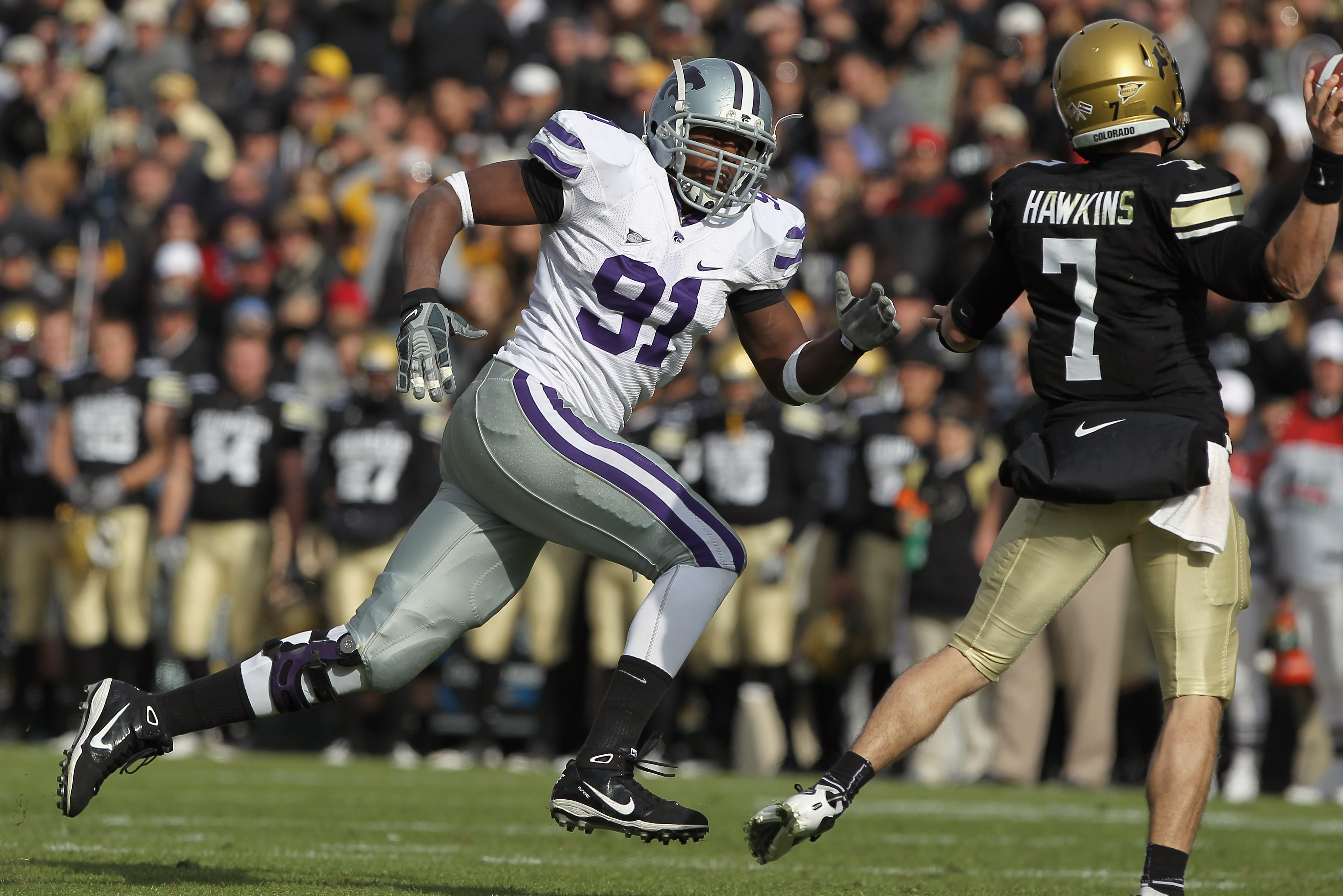 BOULDER, CO - NOVEMBER 20:  Defensive end Brandon Harold #91 of the Kansas State Wildcats rushes quarterback Cody Hawkins #7 of the Colorado Buffaloes at Folsom Field on November 20, 2010 in Boulder, Colorado. Colorado defeated Kansas State 44-36.  (Photo