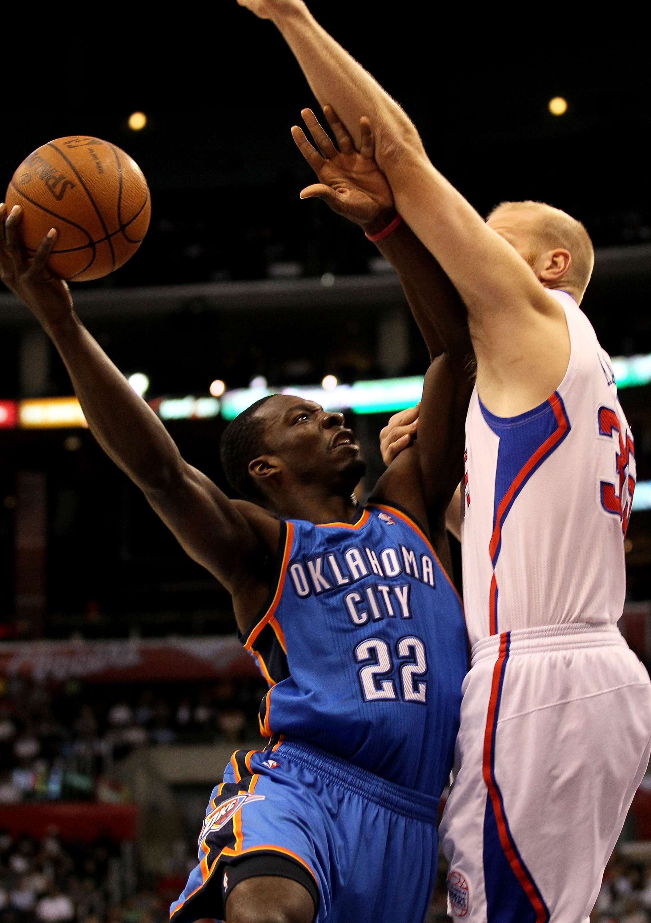 LOS ANGELES, CA - NOVEMBER 03:  Jeff Green #22 of the Oklahoma City Thunder shoots over Chris Kaman #35 of the Los Angeles Clippers at Staples Center on November 3, 2010 in Los Angeles, California.  NOTE TO USER: User expressly acknowledges and agrees tha