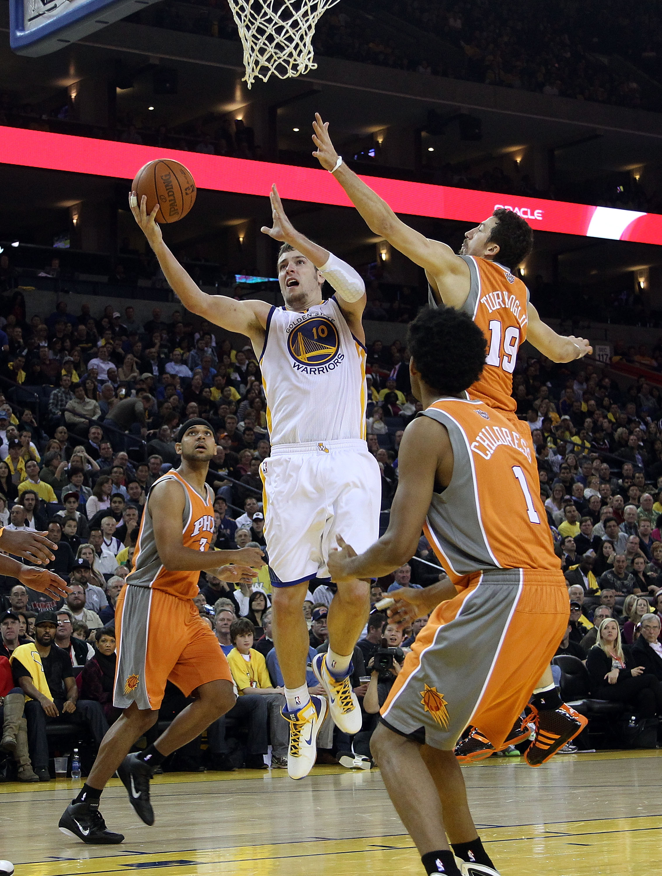 OAKLAND, CA - DECEMBER 02:  David Lee #10 of the Golden State Warriors in action against the Phoenix Suns at Oracle Arena on December 2, 2010 in Oakland, California. NOTE TO USER: User expressly acknowledges and agrees that, by downloading and or using th