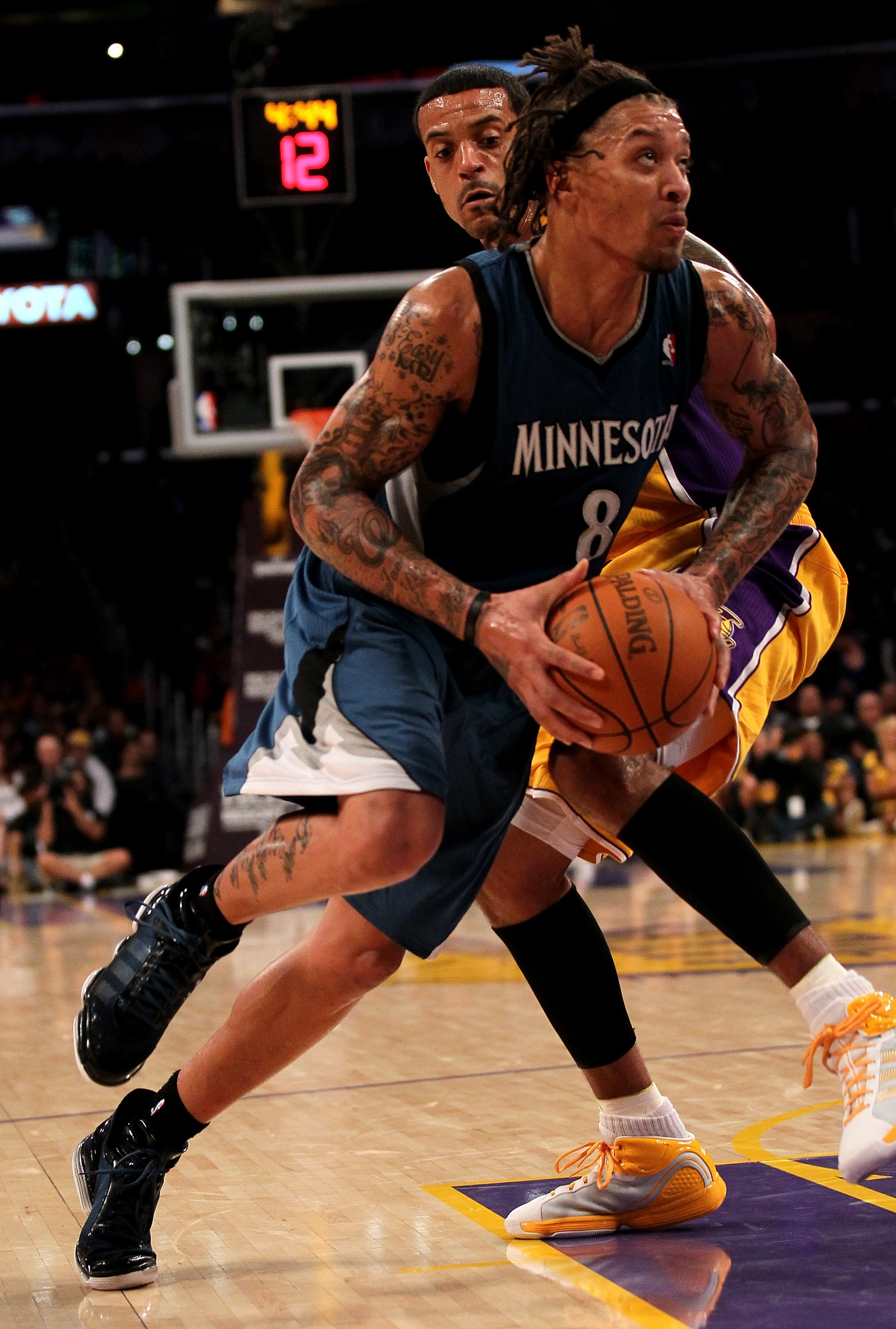 LOS ANGELES, CA - NOVEMBER 09: Michael Beasley #8 of the Minnesota Timberwolves drives past Matt Barnes #9 of the Los Angeles Lakers at Staples Center on November 9, 2010 in Los Angeles, California. The Lakers won 99-94. NOTE TO USER: User expressly ac