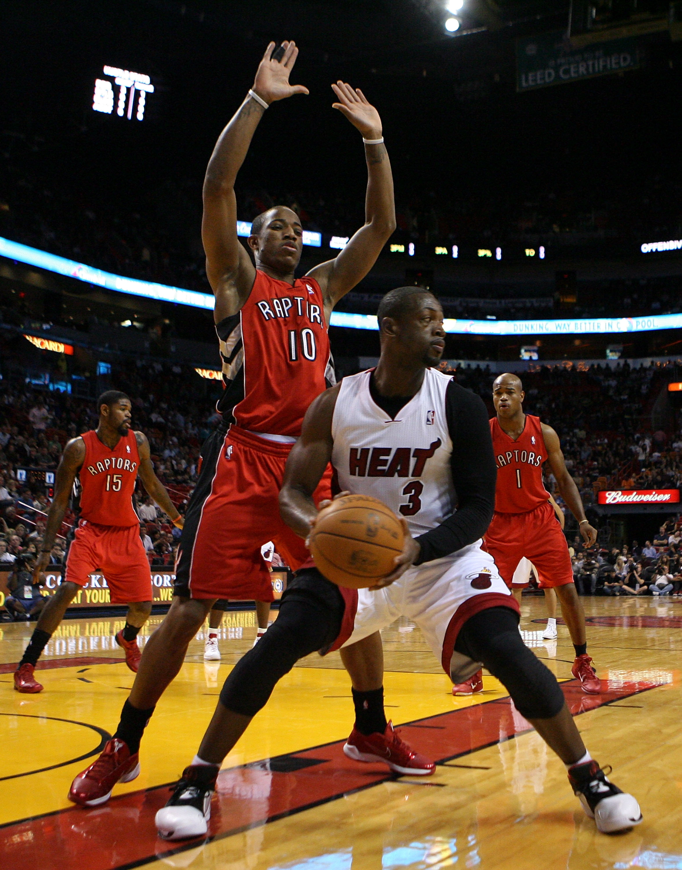 MIAMI - NOVEMBER 13:  Guard Dwyane Wade #3 of the Miami Heat looks to pass against DeMar DeRozan #10 of the Toronto Raptors at American Airlines Arena on November 13, 2010 in Miami, Florida. NOTE TO USER: User expressly acknowledges and agrees that, by do