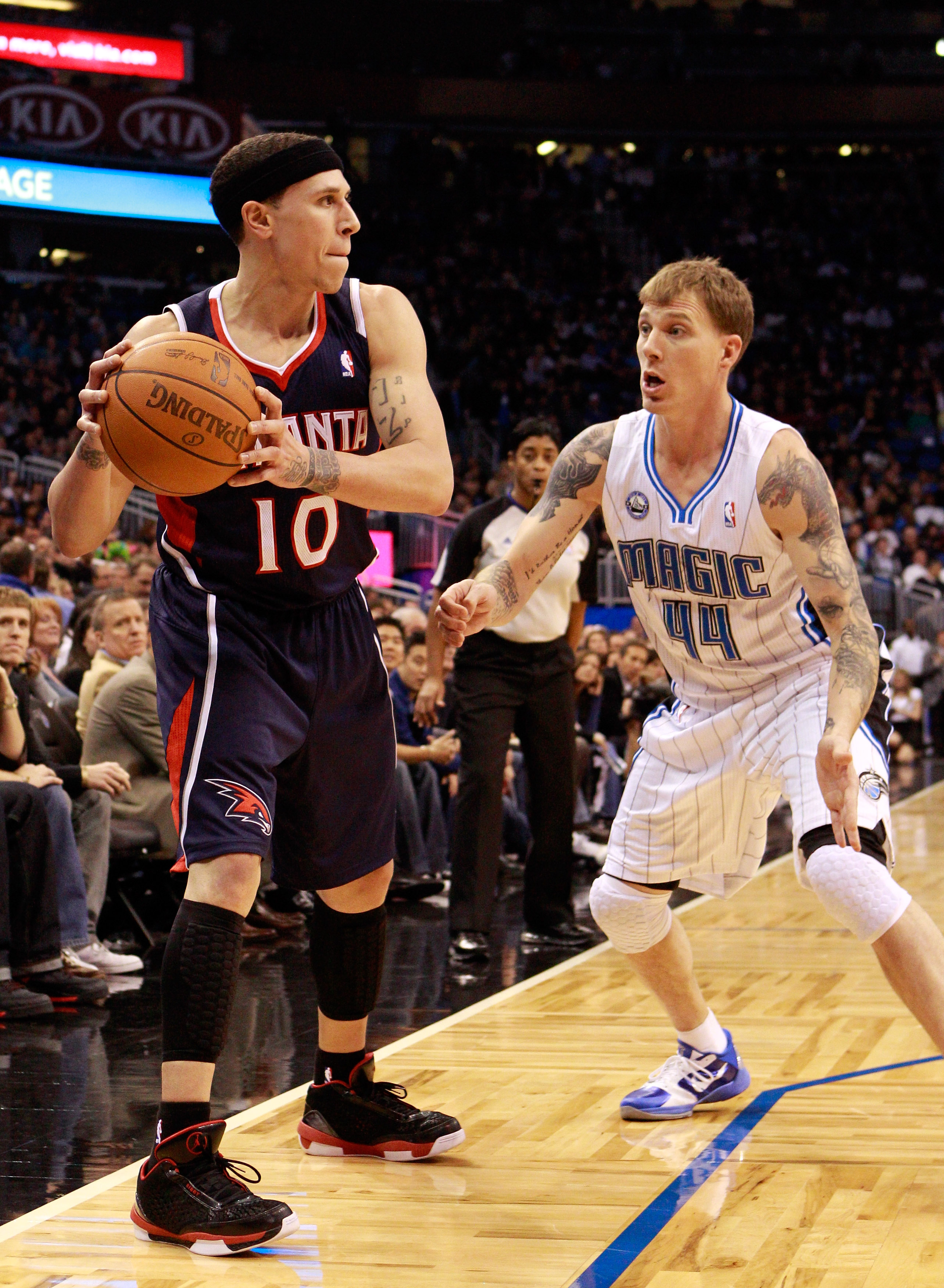 ORLANDO, FL - DECEMBER 06:  Jason Williams #44 of the Orlando Magic guards Mike Bibby #10 of the Atlanta Hawks during the game at Amway Arena on December 6, 2010 in Orlando, Florida. NOTE TO USER: User expressly acknowledges and agrees that, by downloadin