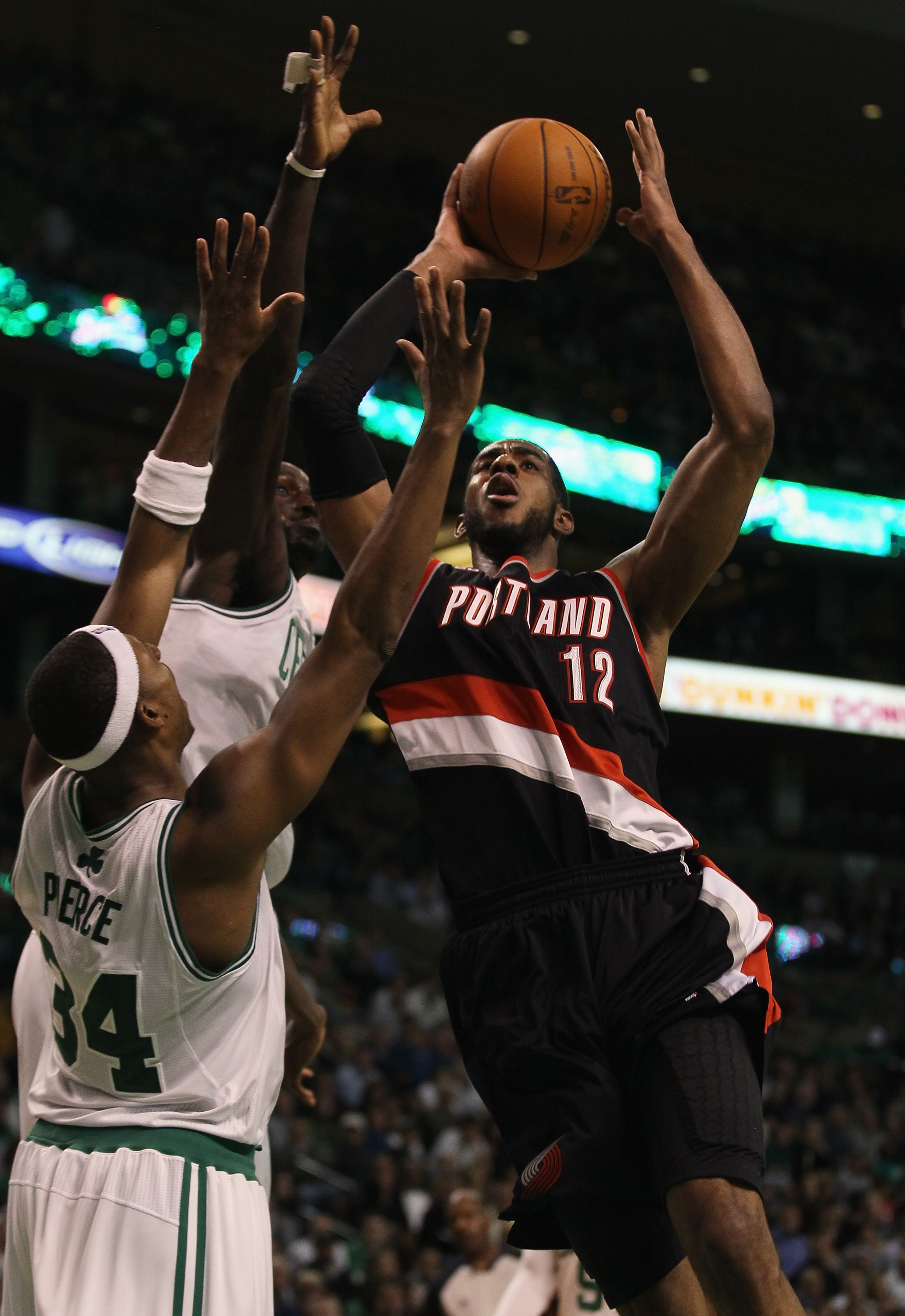 BOSTON - DECEMBER 01: LaMarcus Aldridge #12 of the Portland Trailblazers tries to shoot around Paul Pierce #34 and Kevin Garnett #5 of the Boston Celtics on December 1, 2010 at the TD Garden in Boston, Massachusetts. The Celtics defeated the Trailblazers