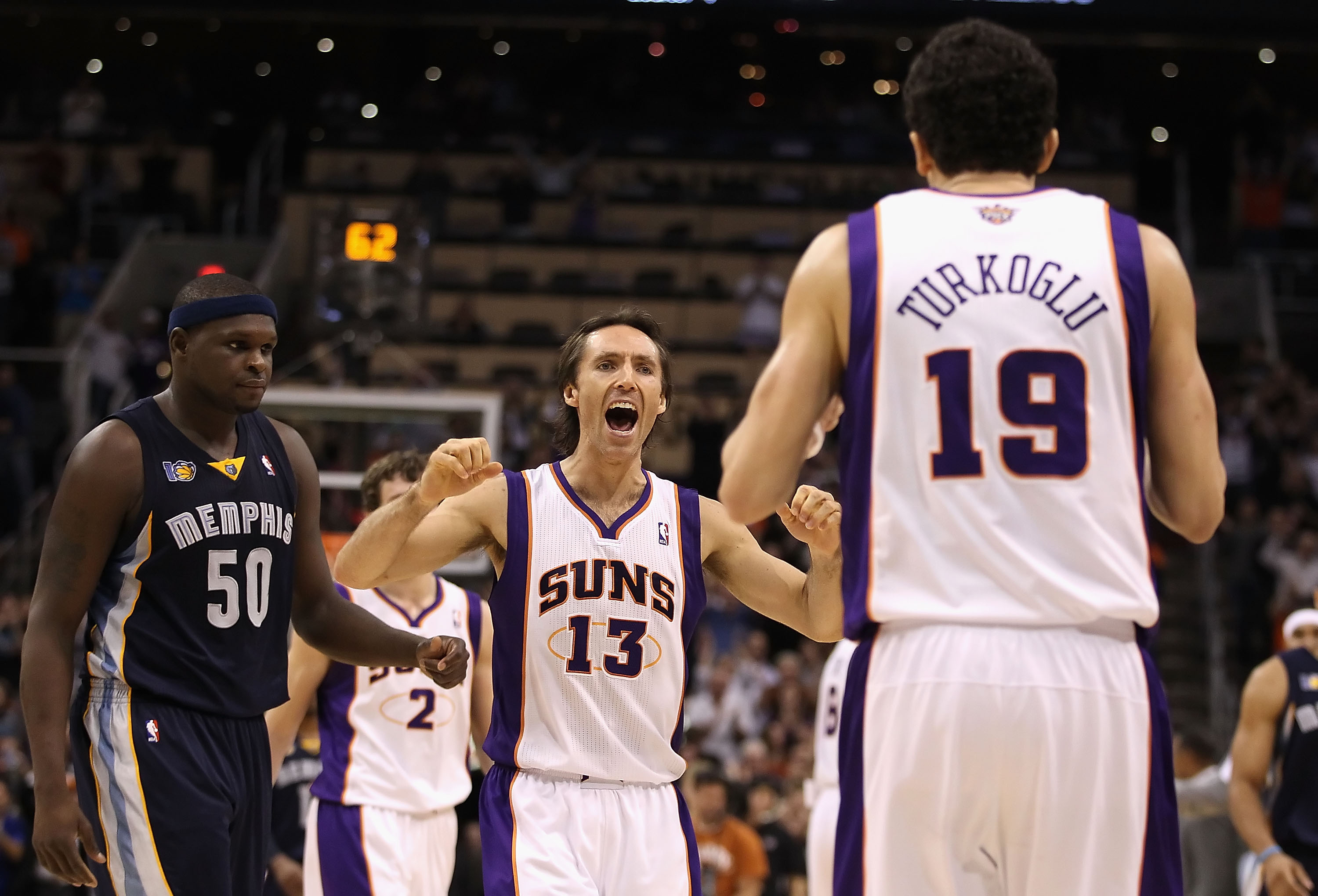 PHOENIX - DECEMBER 08:  Steve Nash #13 of the Phoenix Suns reacts after Hedo Turkoglu #19 hit a go ahead three point shot in the final moments of the NBA game against the Memphis Grizzlies at US Airways Center on December 8, 2010 in Phoenix, Arizona. The 