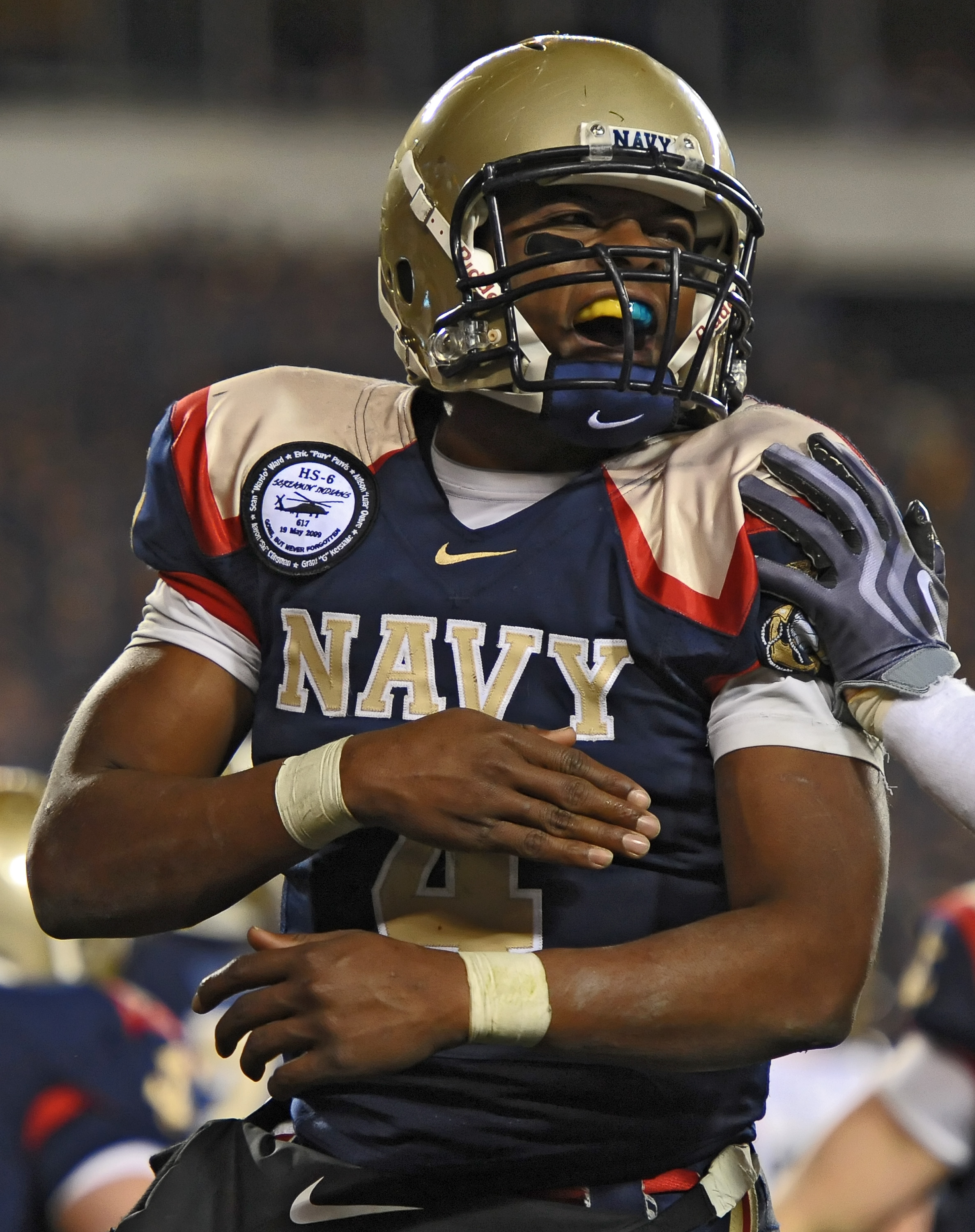 PHILADELPHIA - DECEMBER 12: Quarterback Ricky Dobbs #4 of the Navy Midshipmen celebrates a touchdown during the game against the Army Black Knights on December 12, 2009 at Lincoln Financial Field in Philadelphia, Pennsylvania. Navy won 17-3. (Photo by Dre
