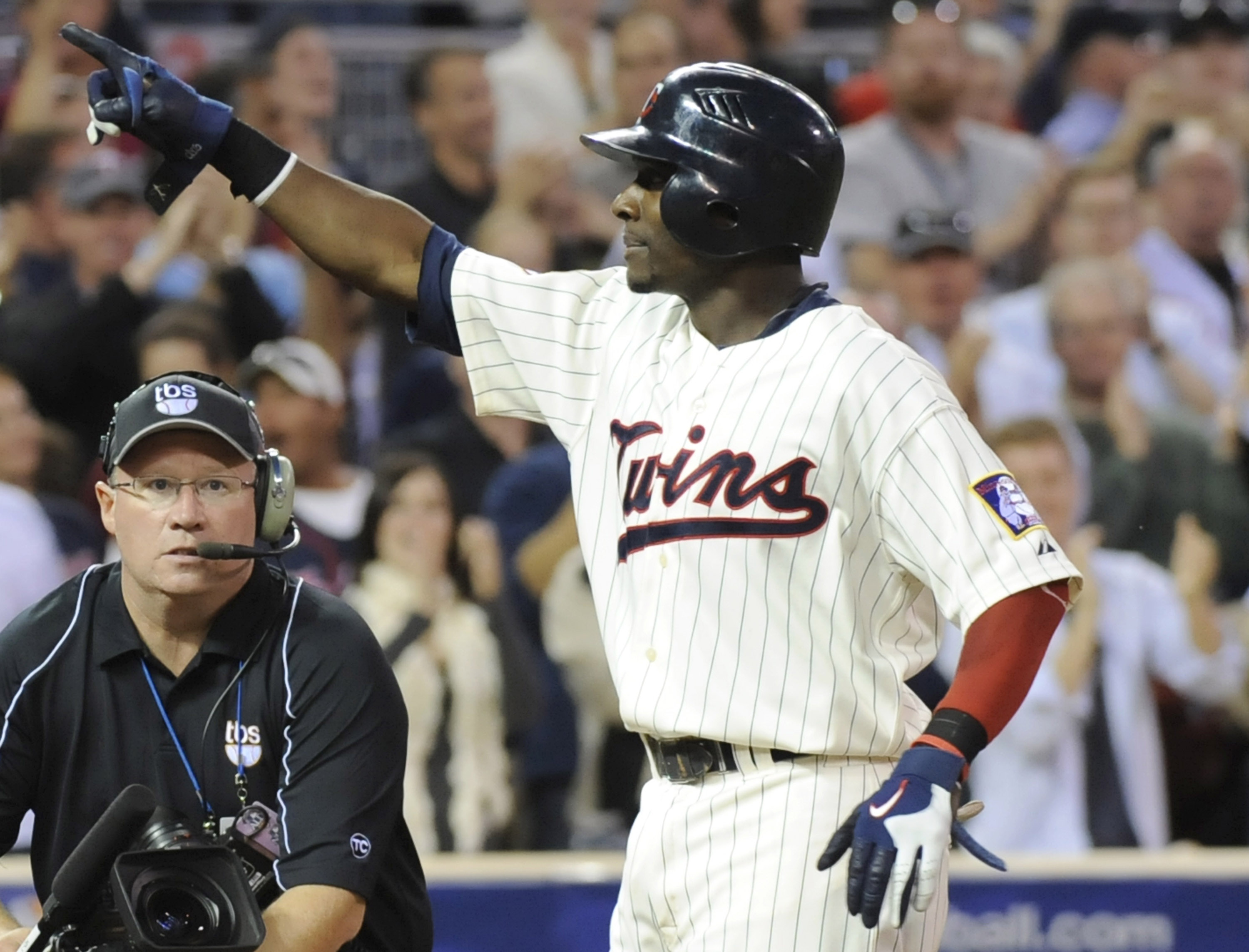 MINNEAPOLIS, MN - OCTOBER 7: Orlando Hudson #1 of the Minnesota Twins celebrates a solo home run in the sixth inning during game two of the ALDS game against the Minnesota Twins on October 7, 2010 at Target Field in Minneapolis, Minnesota.  (Photo by Hann