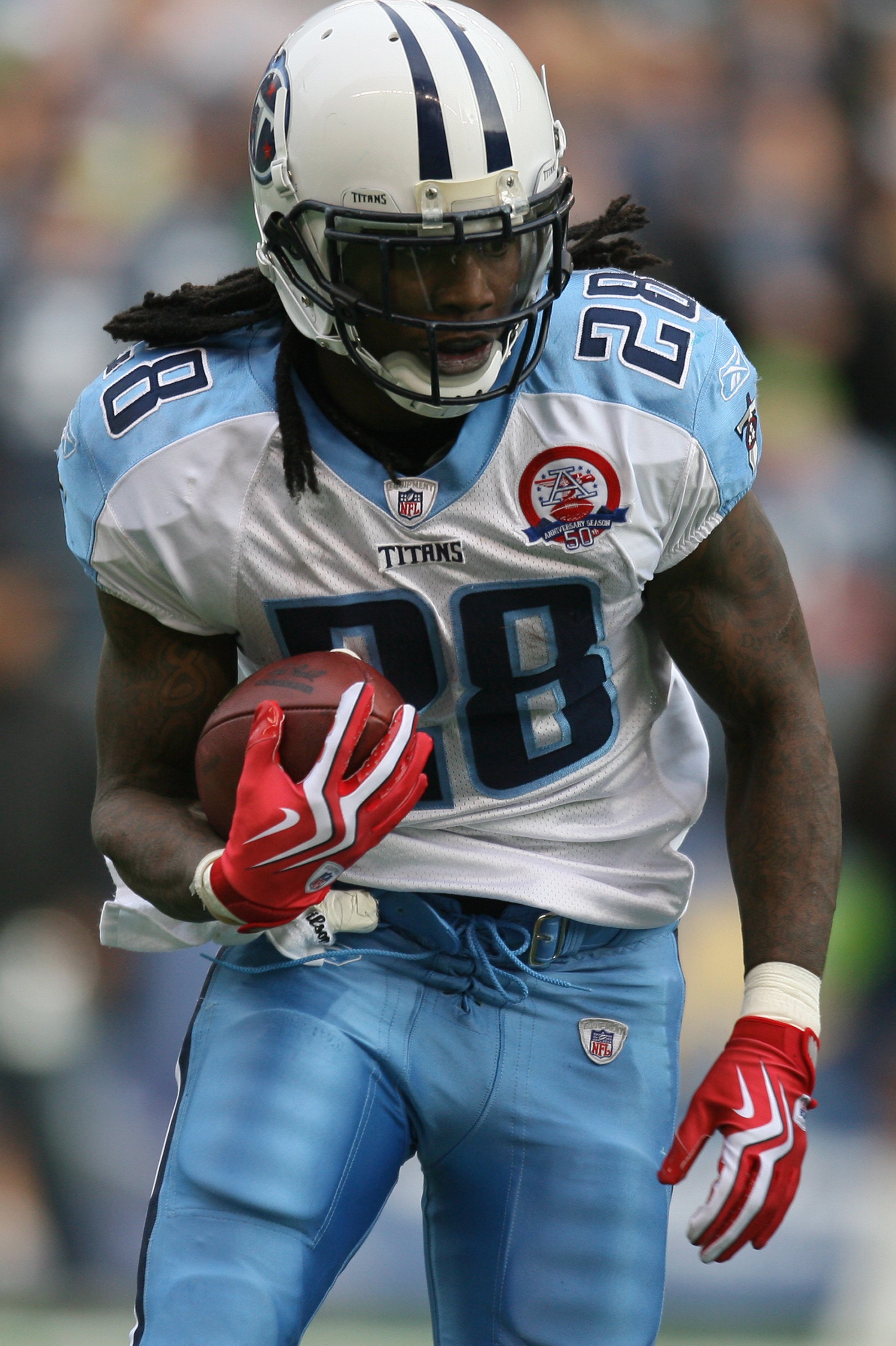 Tennessee Titans running-back Chris Johnson (28) carries the ball