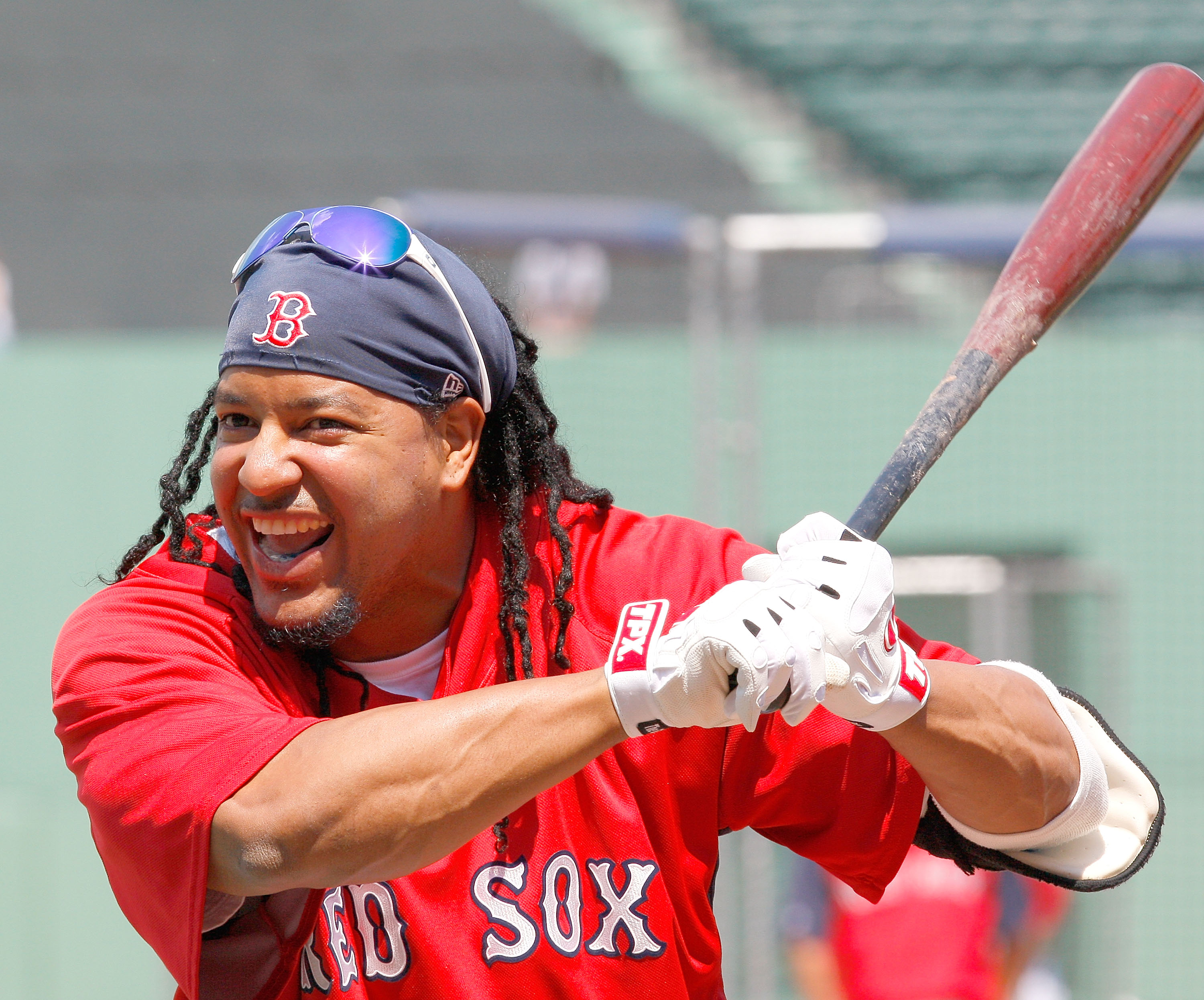 BOSTON - JULY 26:  Manny Ramirez #24 of the Boston Red Sox laughs during batting practice before a game with the New York Yankees at Fenway Park on July 26, 2008 in Boston, Massachusetts.  (Photo by Jim Rogash/Getty Images)