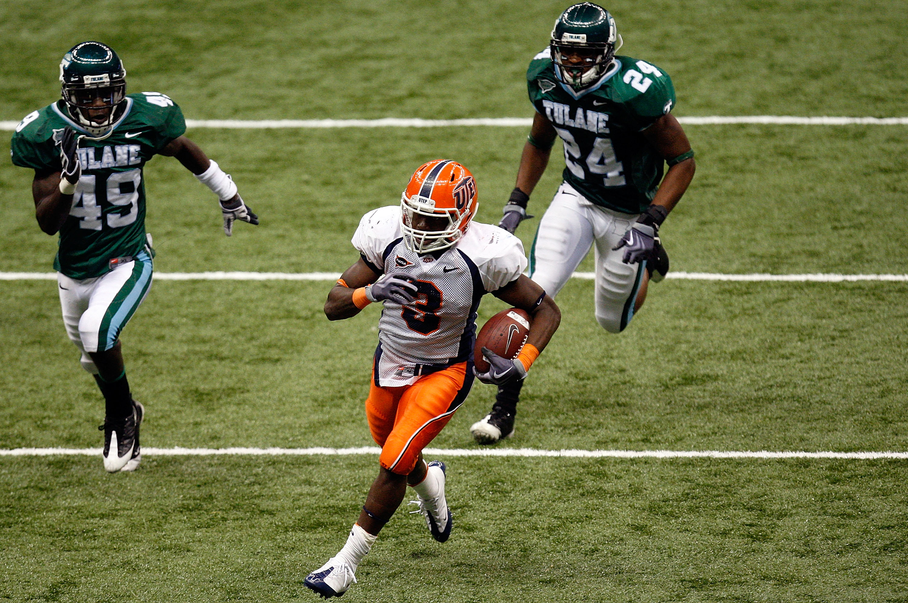 NEW ORLEANS - NOVEMBER 07: Running back Donald Buckram #3 of the UTEP Miners runs for a touchdown past Shakiel Smith #49 and Chinonso Echebelem #24 of the Tulane Green Wave at Louisana Superdome on November 7, 2009 in New Orleans, Louisiana. (Photo by R